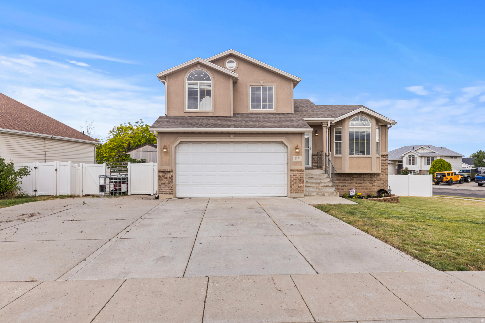 Welcome to this beautifully upgraded 1 bedroom, 2 bath home in heart of Roy. Conveniently located near excellent Weber School District schools, this modern home offers spacious living areas filled with abundant natural light.  The thoughtfully designed main level is perfect for entertaining family and friends, while upstairs  provides the privacy of all bedrooms and bathrooms.  This home has been extensively updated with fresh paint throughout most of the interior, freshly painted doors, new baseboards in both living rooms and two bedrooms, all new door hinges and handles, remodeled bathroom vanities, brand new carpet throughout the upstairs, and new vinyl flooring on both the main and guest living rooms.  Additional improvements include new water pressure tank, new electrical outlets & covers upstairs, a professionally cleaned HVAC system, and all subfloors treated will kilz before the installation of the ew flooring for added durability & peace of mind. The garage has also received professional maintenance with new wheels & struts installed for smooth reliable operation. As an added bonus, the sellers will be installing a brand new mailbox and a new front gate prior to closing, Build with classic brick and stucco. The home features an beautiful combination of carpet, tile & vinyl flooring, along with a relaxing jetted tub in the primary bathroom.  With its modern updates, inviting layout and exceptional location this move in ready home offer the perfect blend of comfort, style and functionality. Don't miss the opportunity to make this Roy home yours!