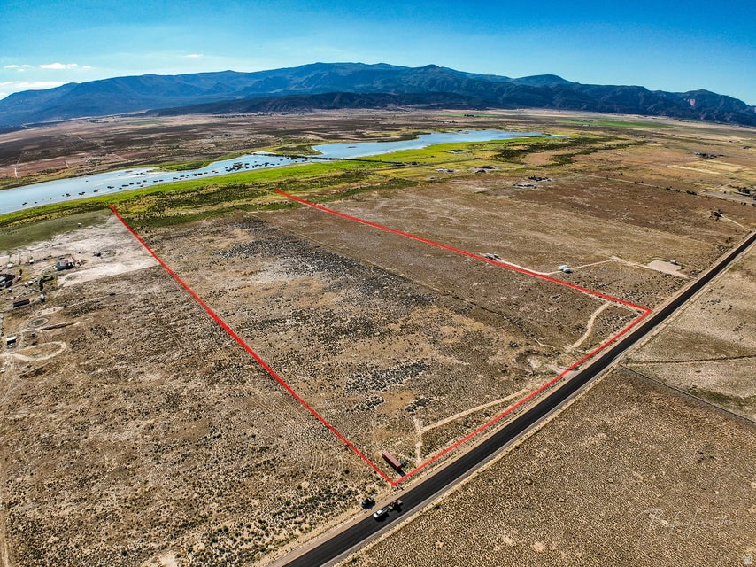 56+ Acres of Opportunity - Water, Power, and Room to Dream! If you've been looking for the perfect place to build, farm, or create your own country escape, this 56+ acre property could be exactly what you need! Flat, fully fenced, and ready for your vision, this land is a true blank slate with all the essentials already in place. Located just a short drive from Cedar City, you'll enjoy the peace and quiet of rural living while still being close to town for shopping, schools, and more. It's the best of both worlds--private and peaceful, but still convenient. Plus, with year-round access, you'll never have to worry about getting to your property, no matter the season. One of the biggest bonuses is the water. With 14.87 acre-feet of water rights, you'll have more than enough