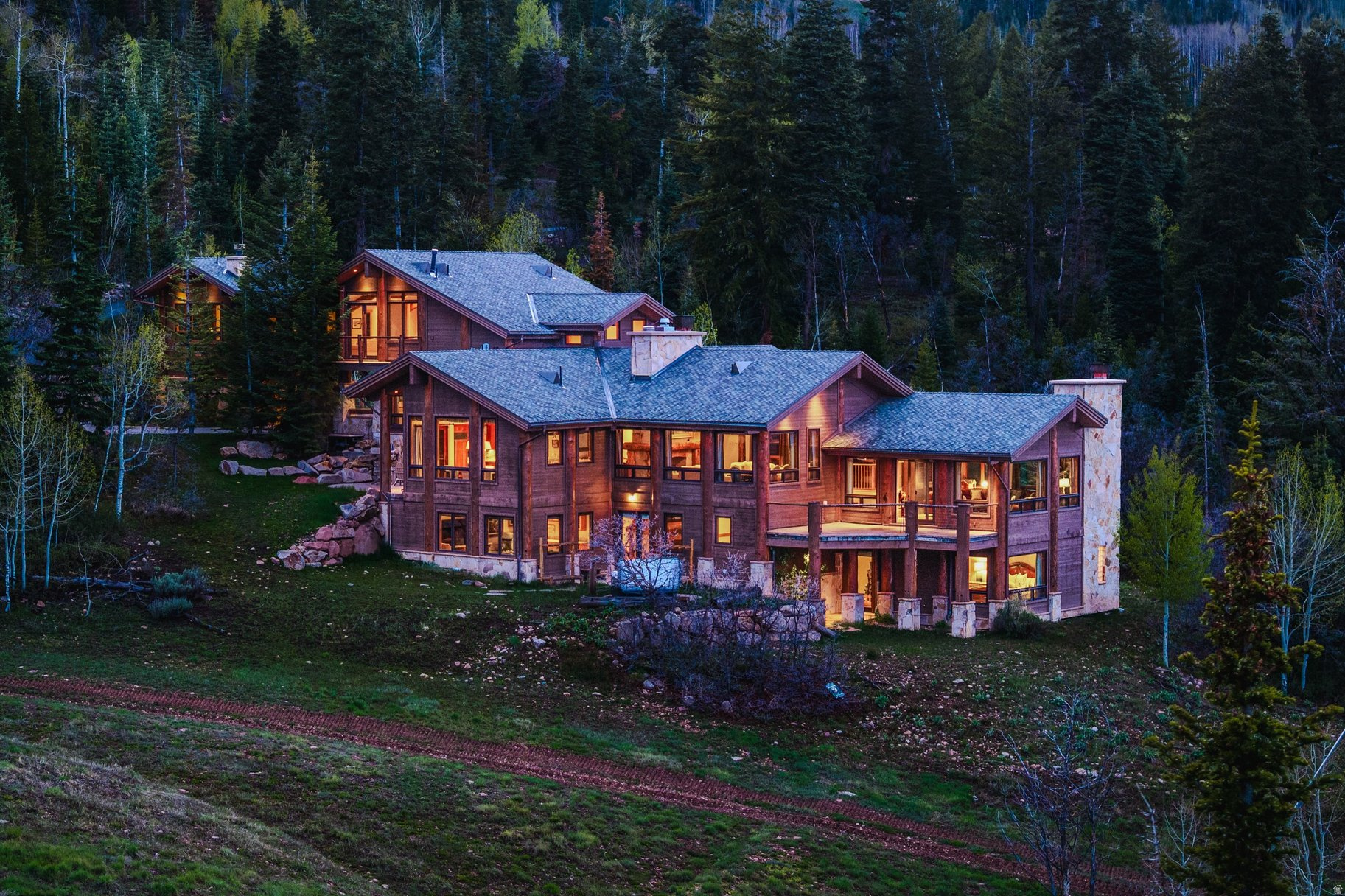 Set within the private, gated community of The Colony at White Pine Canyon, this legacy mountain retreat offers a wonderful setting for family and friends to enjoy four-seasons of unparalleled mountain living. Positioned on a flat, premier lot in Phase One spanning over five acres, this ski-in/ski-out home is adjacent to an easy section of Lower Crowning Glory accessible for all ski abilities. A large kitchen provides the heart of the home, with multiple gathering areas on each level highlighted by rich wood flooring, stone fireplaces, and elegant appointments, providing warm and inviting areas for easy entertaining. A private, luxurious primary suite on its own floor includes a sitting room and office set in the trees with sweeping mountain views, with five additional bedrooms and a bunk room providing room to host large gatherings. An oversized ski prep room with fireplace is an easy staging area for access to Lower Crowning Glory ski run and The Colony's private network of hiking and biking trails. Access to The Colony's new exclusive mountain clubhouse will offer fine dining, social events, and convenient ski-in lunch options. Ideally located, this mountain retreat is just 5 minutes from The Colony community gate and 10 minutes from Canyons Village dining, shopping, outdoor concerts and entertainment