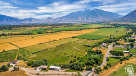 STUNNING 76+ acre family farm & 2 homes in Spanish Fork River Bottoms. Very seldom does a property of this size in this area come available! Sweeping views of the Wasatch Front Mountains. Green pastures and a serene atmosphere that is simply hard to come by. Centrally located and nestled in the heart of one of Utah County's fastest growing communities. Spanish Fork is where growth and all things are happening. Minutes to I-15 15 minutes to Provo. 45 to SLC. Great future investment. Approximate address is 19 East South Field Road between South SF Main Street and entering Salem. The listing includes the following parcels, 27:045:0062 and 25:068:0178.  Taxes are also an estimate. as the property has been in greenbelt. Listing Agent and listing brokerage accepts no responsibility or liability for the information contained in this listing. An interested party buyer and or buyer broker should conduct an independent inspection and investigation to verify the information.