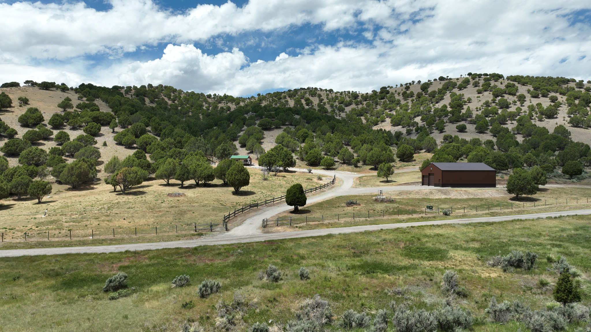 Mountain Retreat with Year-round Access, Power, Well and Shop - Five contiguous 5 to 5.6-acre residential lots (Lots 14, 15, 16, 17 and 18 in Great Columbia Subdivision) - Year-round county gravel road access and fenced road frontage - Cleary 50' x 42' drive through shop (no electricity to shop) - Power: 200 amp to modest dry cabin and 100 amp to pump house - Pump house equipped with baseboard heaters, shower, sink, pressure tank and compost toilet - Well approximately 140' deep - 900-gallon septic tank - Wood stove - 1/4 mile from BLM sportsman's access - Elk, moose, mule deer. mountain lions - Hunting Unit 72 -- Discover the possibilities with five contiguous parcels, ranging in size from five to five and a half acres in the Great Columbia Subdivision located halfway between Lava Hot Springs and Soda Springs, within walking distance from BLM sportsman's access. Offering year-round county-maintained road access and multiple parcels with residential build rights and power stubbed, this property is well-positioned for a private mountain retreat, future homesites, or a long-term investment. With existing infrastructure already in place, it is primed for the mountain cabin you've always dreamed of.  The property boasts almost one third of a mile of frontage on Swenson Valley Road with wood post and quarter inch cable fenced frontage and gated driveway for privacy. In addition to year-round access, this mountain property also has the convenience of mail delivery, garbage service, and potential school bus service.  The infrastructure provides a turnkey opportunity to enjoy the property while you plan your dream cabin build. Power has been pulled to the modest one-room dry cabin and the pump house.  The cabin sits on railroad ties with French drains and is equipped with 200-amp electrical service, a wood burning stove and baseboard heaters plus an attached RV cover.  The pump house has a small deck to enjoy wildlife viewing and is equipped with 100-amp service, a small refrigerator, shower, sink, pressure tank and composting toilet.  An underground artesian well, approximately 140 feet deep, plus a 900 gallon septic tank service the lot. and a limestone gravel driveway provides access and parking for your guests to visit.   The jewel of the property is the Cleary shop.  Built in 2019, the 50' x 42' Cleary shop is reinforced with trusses approximately every ten feet and features two chain driven 10'x12' overhead doors and one 12'x12' overhead door on one side and one of each on the other side, providing drive-through access for RVs, boats, trailers, ATVs, and equipment.  A power cord to an outlet outside the shop provides electricity, since power has not been pulled to the shop.  Located in Idaho Fish & Game Hunting Unit 72 near BLM, and the Cache and Caribou National Forests, the area is known for abundant wildlife, including elk, moose, mule deer, and mountain lions and hundreds of miles of dirt roads and trails to explore horseback riding, hiking, backpacking, camping, mountain biking, cruising in ATVs, wildlife viewing, and big game and upland game hunting.  Winter access to the public land requires a snow machine and opens the door to a magical winter wonderland adventure snowmobiling, fat tire biking, cross-country skiing and snowshoeing.    The nearby Blackfoot Reservoir and Alexander Reservoir offer excellent fishing for trout, kokanee, perch, and more, along with boating and other water recreation.  Float, fish, or swim along the Bear River and Portneuf River, or enjoy a relaxing soak in the Lava Hot Springs mineral pools and return to warm up by a fire and enjoy wildlife viewing from the privacy of your own backyard.    Whether your passion is hunting, fishing, hiking, ATV riding, snowmobiling, or simply enjoying the peace and beauty of Idaho's mountains, this property provides the space, infrastructure, and flexibility to make it your own.  Build your dream cabin, establish your recreational basecamp, or invest in a proper