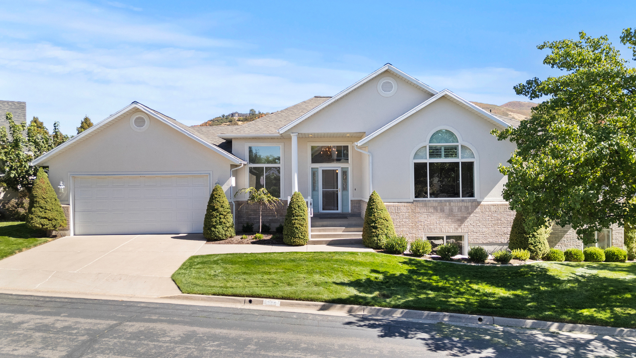 Spacious 4000 sq ft main floor living home, fully finished, located on the East Bench of North Salt Lake, in the prestigious Eaglewood Estates community, tucked away in a quiet cul-de-sac surrounded by the Eaglewood Golf Course. Enjoy easy access to downtown, the airport, Bonneville Shoreline Trail, Eaglewood Golf Course, Mueller Park, and beautiful mountain views from the large back yard patio. From the moment you enter the home you are greeted with openness and light--from the marble floor entry with a beautiful chandelier to the spacious open kitchen and family room, to the finished basement with an expansive family room, full kitchen, 3 bedrooms, and 2 baths. The home enjoys a spacious master suite with a walk-in closet and a beautiful large ensuite bathroom with jetted tub, standing shower, dual sinks and plenty of counter space.  The kitchen has beautiful hardwood floors with lots of counter space and cupboards, a long island with swinging chairs for easy meal prep and consumption--with the convenience of the laundry room right next door with a built-in ironing board!  There is plenty of storage throughout, from the basement cold storage (shelves included), multiple closets in bedrooms and hallways, and cupboards galore in the laundry room and garage! **Brand new furnace in July 2025, roof replaced 2 years ago, natural gas generator located outside the home, water softener, heated roof tape, newer carpet throughout, and even a chair lift for the garage steps!  This home is truly a MUST SEE to experience its tranquil location, incredible floor plan, and spacious living.  Square footage figures are provided as a courtesy estimate only and were obtained from county records.  Buyer is advised to obtain an independent measurement. Agent is related to Seller.