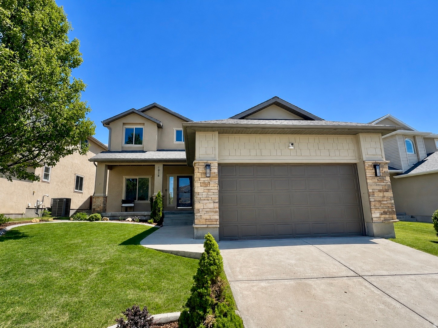 Welcome to this stunning five-bedroom, four-bathroom home nestled in the highly sought-after Traverse Mountain community, just a short drive from Silicon Slopes. Recently painted, brand new carpet and updated throughout, this home offers a fresh, modern feel. The open and inviting layout features a spacious kitchen with a large island, updated appliances, and beautiful granite countertops. The main level includes a bedroom and full bathroom, along with a versatile office or den space. Upstairs, you'll find three additional bedrooms and two full bathrooms, offering plenty of space for family and guests. The fully finished basement is a bonus with a bedroom, full bathroom, large family room, and movie theater space. Recent upgrades include a new water softener and water heater. Step outside to enjoy the incredible backyard, complete with rock work, a fully fenced yard for privacy, and breathtaking views. This home combines comfort, style, and location-truly a must see!