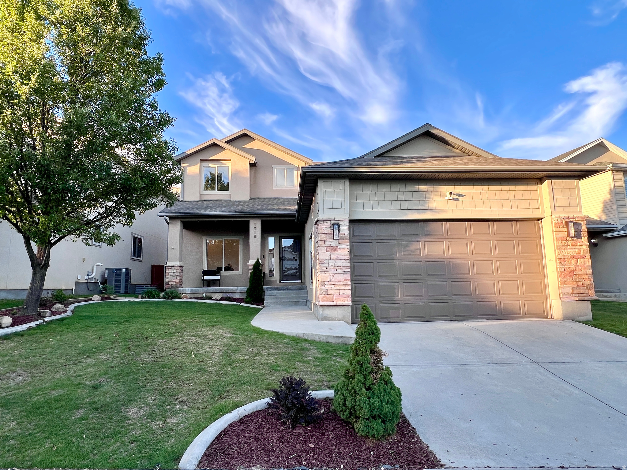 Welcome to this stunning five-bedroom, four-bathroom home nestled in the highly sought-after Traverse Mountain community, just a short drive from Silicon Slopes. Recently painted and updated throughout, this home offers a fresh, modern feel. The open and inviting layout features a spacious kitchen with a large island, updated appliances, and beautiful granite countertops. The main level includes a bedroom and full bathroom, along with a versatile office or den space. Upstairs, you'll find three additional bedrooms and two full bathrooms, offering plenty of space for family and guests. The fully finished basement is a bonus with a bedroom, full bathroom, and a large family room. Recent upgrades include a new water softener and water heater. Step outside to enjoy the incredible backyard, complete with rock work, a fully fenced yard for privacy, and breathtaking views. This home combines comfort, style, and location-truly a must see!