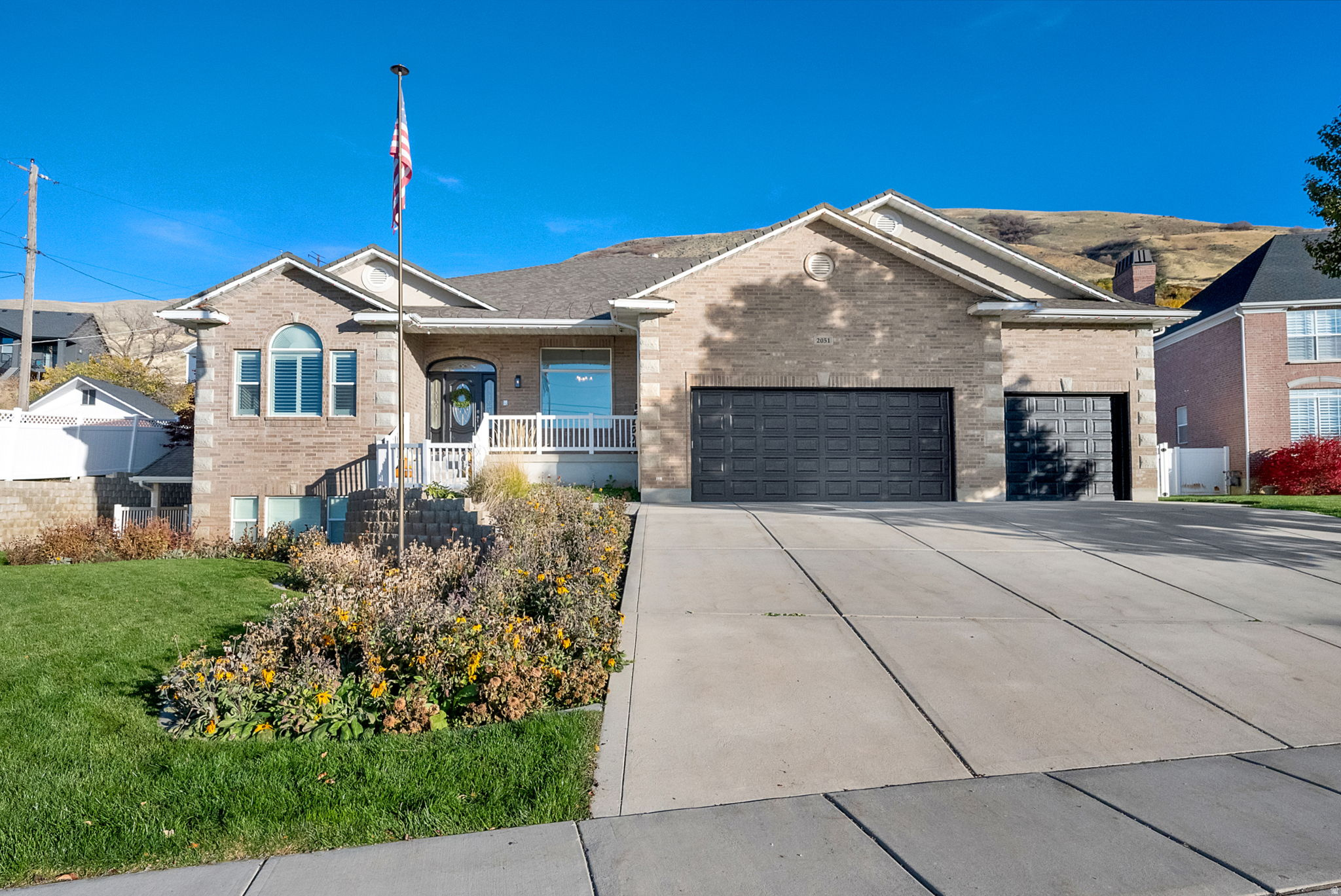 PERRY EAST BENCH! UNOBSTRUCTED VIEWS ! This stunning , All brick, west facing home, offers a perfect blend of luxury and family living. The large over 1/2 acre view lot, features no backyard neighbors and unobstructed mountain and valley views that create a tranquil atmosphere. Inside you will find spacious open concept living, with 10 ft. ceilings on both main and basement levels. The home is one level living at it's best! Highlighted by a large family great room, sunroom and 1/2 bath that seamlessly connects to an oversized, Chef's Gourmet Kitchen, equipped with new stainless steel appliances, including double ovens, and an abundance of upgraded staggered cabinetry, large pantry and farm sink. The home has been meticulously remodeled with 3 inch quartz countertops, new carpet, fresh paint, LED lighting and LVP flooring in the bathrooms, laundry room and sun room. Includes 3 bedrooms up, 2, and 1/2 baths, formal living room/office, and separate craft room/exercise room. Step outside to your backyard oasis, complete with a large covered deck, featuring TREX decking, 2 ceiling fans and a natural gas BBQ, making it perfect for entertaining. The beautifully landscaped park like yard incudes full yard LED flood lighting, in ground fire pit, a basketball court, 4 square, a sand play area with swing set, and putting green, all surrounded by mature trees and shrubs and fully fenced. For added convenience, the home is equipped with an in home elevator and a separate chairlift in the spacious 3 car garage, ensuring ease of access throughout. Home is wired for a whole home generator. The oversized primary suite, boasts an extra large ensuite bath, and walk in closet, that connects to the laundry room, along with double vanities and an extra large tub and separate shower for your comfort. The basement features a private, covered walkout, daylight entrance, for the potential mother in law apartment, in floor heating, 3 bed, 2 bath, 2nd laundry, home theater room, indoor exercise lap pool and tons of storage. The roof was replaced in 2017. 100 % WHEELCHAIR ACESSABLE. Located on a quiet street surrounded by spacious estate homes, this property is not just a house, its a home where memories are made! All just a short drive from city parks, schools, shopping, restaurants, entertainment, skiing, boating and freeway access! Come experience the perfect blend of luxury and comfort - your Family's Gathering Paradise awaits!!! Owner agent.