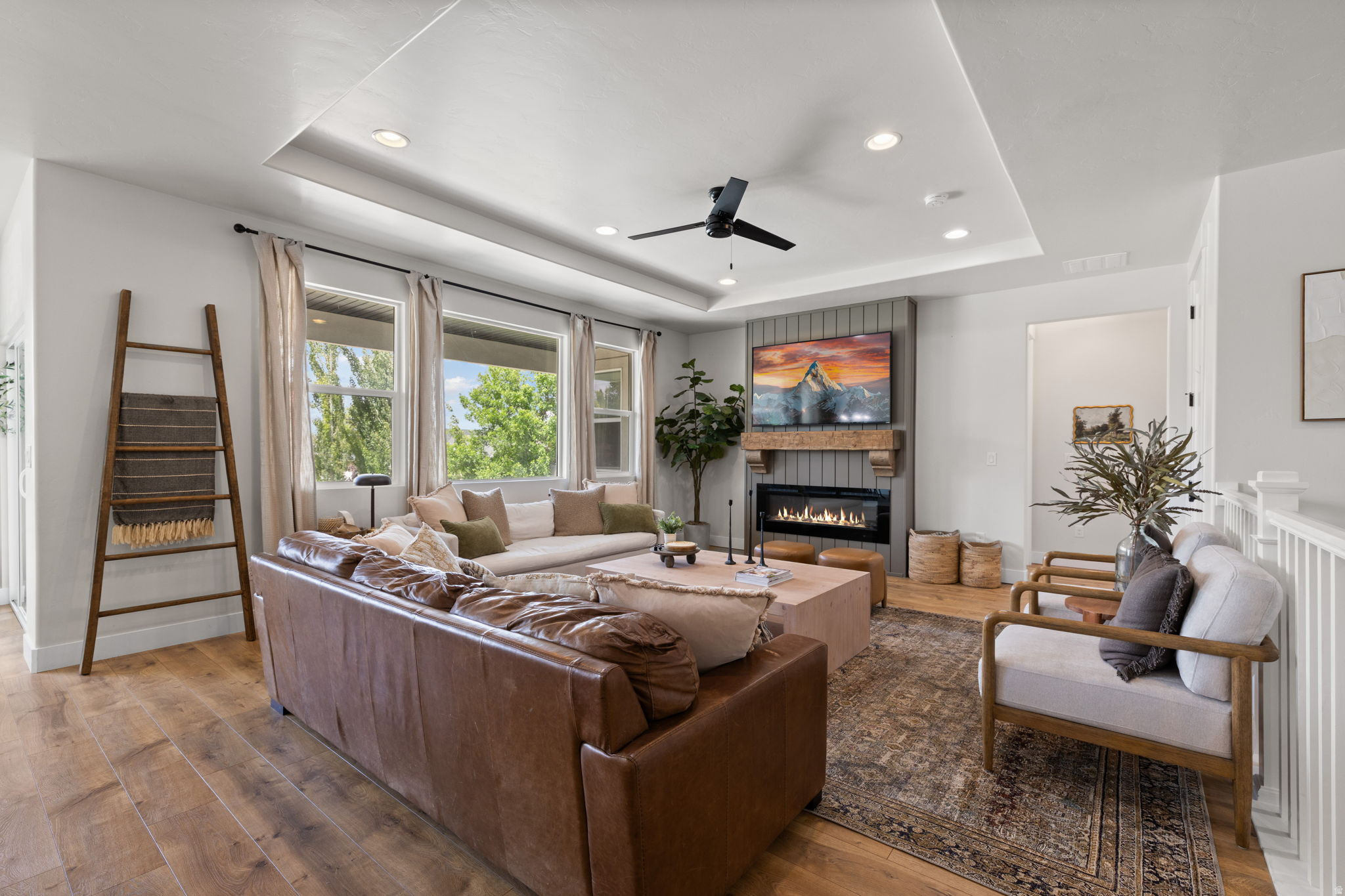 Rarely does a home combine this much space, functionality, and quality in one package. Built in 2018, this custom rambler offers over 4,200 finished square feet with 6 bedrooms, 4 bathrooms, main-floor living, a fully finished basement, RV parking, and a 3-car garage, all in one of Riverton's most sought-after neighborhoods.  Inside, you'll find an open-concept floor plan designed for the way families actually live. The spacious kitchen flows seamlessly into the dining and great room, creating the perfect space for entertaining or everyday life. The private main-floor primary suite offers convenience, while the finished basement expands your living space with additional bedrooms, a large family room, and a wet bar ready for movie nights, game days, or hosting guests.  Outside, the backyard is truly an extension of the home. Enjoy a covered patio with a dedicated gas line for grilling, gather around the custom gas fire pit, and unwind in a beautifully landscaped yard with landscape lighting and mountain views. Thoughtful upgrades throughout, including smart home features, a radon mitigation system, generous storage, and quality finishes, make this home as functional as it is beautiful.  Located just minutes from parks, schools, shopping, dining, and commuter routes, this is a rare opportunity to own a newer custom rambler with the space, layout, and features buyers are searching for. Schedule your private showing today.