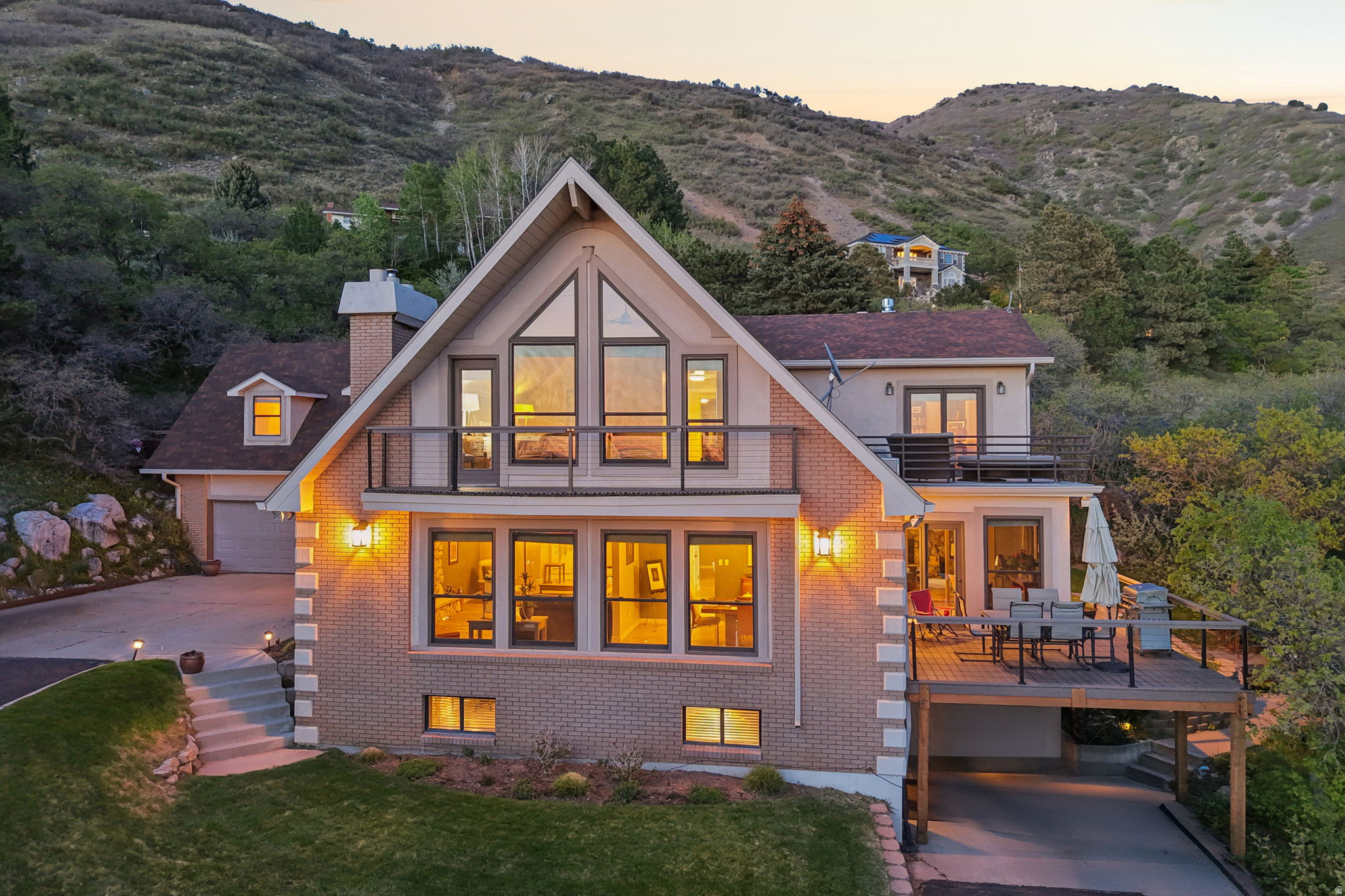 Exceptional luxury home with panoramic valley views from nearly every room. Perfectly positioned for privacy while offering quick access to shopping and Highway 89. Enjoy outdoor living at its finest with six decks, including a private hot tub deck ideal for sunset views. Inside, large windows and fireplaces create a warm, inviting atmosphere that highlights the surrounding natural beauty. Designed for versatility, the home features a full apartment with separate entrance-ideal for multi-generational living or additional income-along with single-level living options on two of the three levels. A rare opportunity to own a home that combines space, views, and functionality.