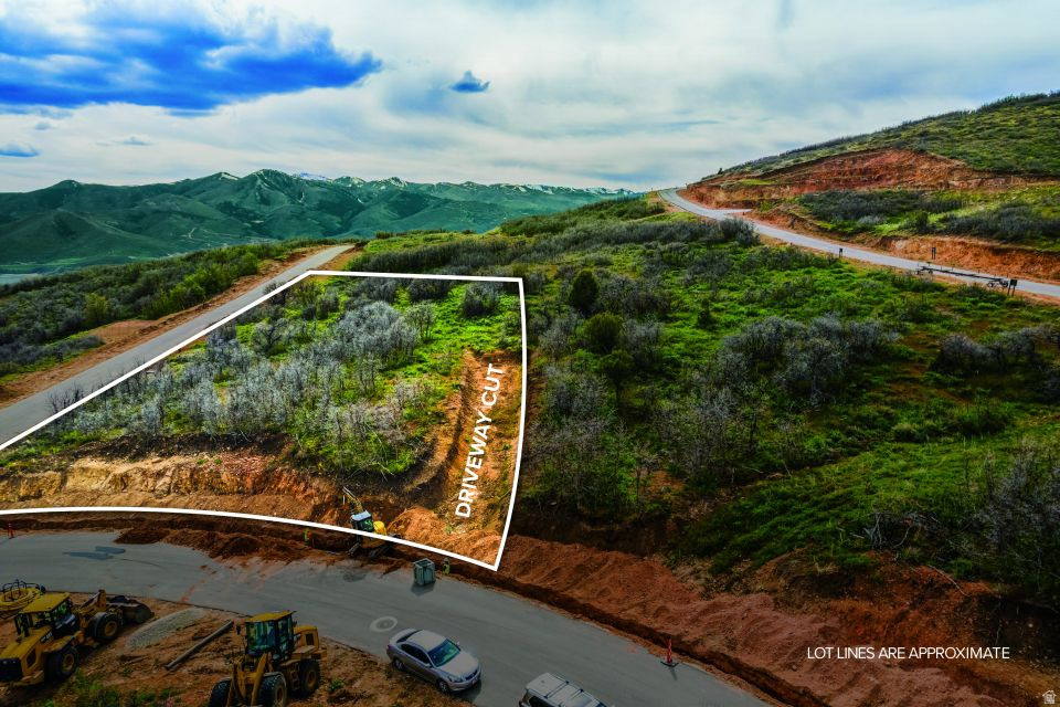 Exceptional Golden Eagle homesite offering sweeping mountain, lake, and ski resort views just outside Park City. This well-positioned lot features a driveway already cut in, helping simplify future build planning. Enjoy convenient access to Jordanelle Reservoir, Park City Mountain, Deer Valley, Mayflower, trails, fishing, golf, and year-round outdoor recreation throughout the Wasatch Back. A rare opportunity to create a custom mountain retreat in one of the area's most scenic view communities.