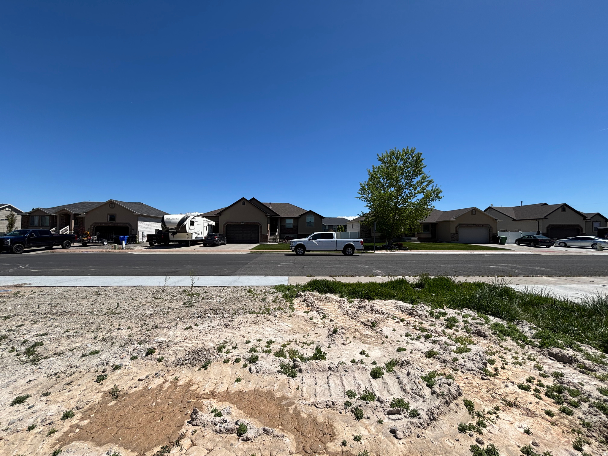 Build your custom dream home with our exclusive homebuilder. It's a fully improved lot, with culinary water, secondary water, sewer, power and High-Speed Internet stubbed to the lot line and ready to build on. Gas will be stubbed within 1-2 weeks. 5/1/26. Don't wait give me a call today! *THIS LOT IS NOT AN EXCLUSIVE LOT - BRING YOUR OWN BUILDER