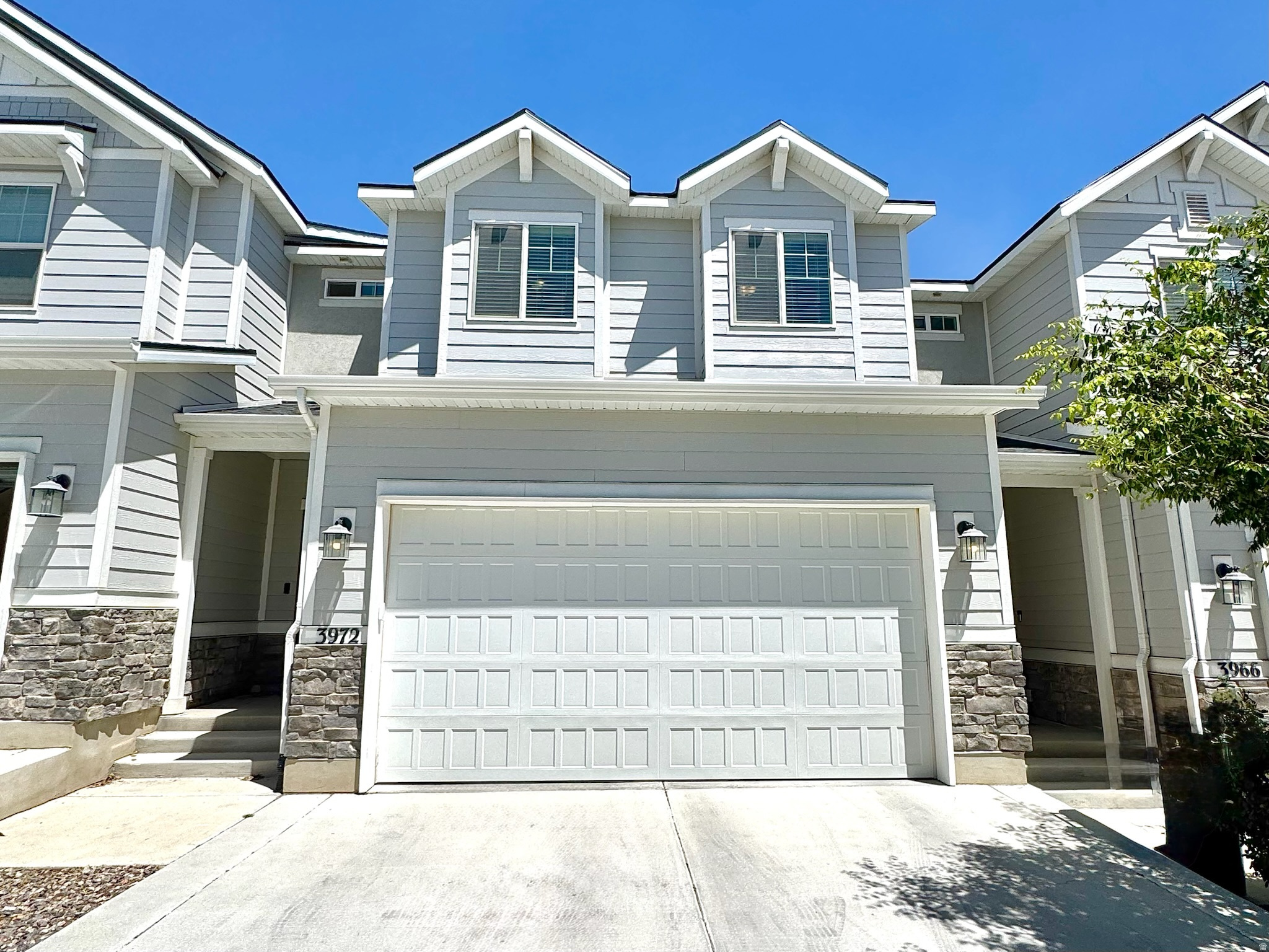 This beautifully maintained Lehi townhome offers 2,395 sq ft of modern living across three thoughtfully designed levels. Built in 2021, it features an open-concept main floor with 9-foot ceilings, an oversized island, upgraded solid-surface countertops, premium cabinetry, and brand-new carpet-perfect for everyday living and entertaining. A spacious two-car garage adds convenience and extra storage.  Upstairs, you'll find a generous primary suite with a walk-in closet and private ensuite bath, along with two additional bedrooms and a full bathroom. The unfinished basement provides an excellent opportunity to add future living space, a home gym, office, or additional storage to fit your needs.  Conveniently located just minutes from Silicon Slopes, shopping, dining, and outdoor recreation, this home offers the perfect blend of comfort, convenience, and location. Whether you're looking for a primary residence or a strong investment property, this home is an exceptional value. Don't miss this opportunity!