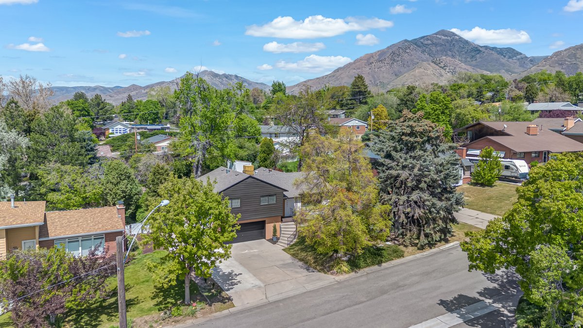 Beautifully redone home in one of Holladay's most sought-after neighborhoods, just a few streets from downtown Holladay and minutes to the mountains. Incredible mountain views, thoughtfully designed for both entertaining and everyday living. Standout accent walls and a truly one-of-a-kind feel throughout. Square footage figures are provided as a courtesy estimate only and were obtained from County Records.  Buyer is advised to obtain an independent measurement.