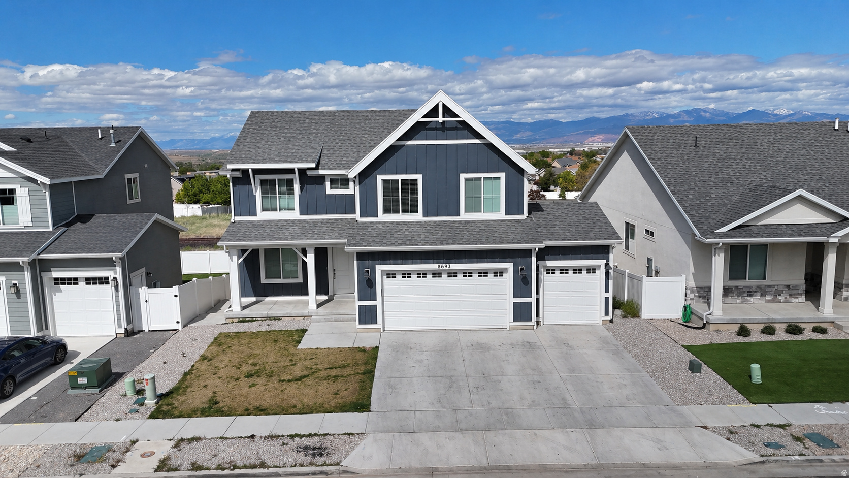 Better than new-and ready to impress! This stunning modern two-story home offers 7 spacious bedrooms, including 5 upstairs, along with 2 full bathrooms and a convenient upstairs laundry room.  The main level features a dedicated home office off the front entry, a spacious open-concept kitchen and living area, a powder room, and a functional mudroom.  The fully finished daylight walk-out basement adds incredible flexibility with 2 additional bedrooms, a full bathroom, a second laundry area, kitchen, and living room-ideal for guests, multi-generational living, or potential rental income.  Step outside and take in the breathtaking views of the Wasatch Mountains and Salt Lake Valley from your deck, with no backyard neighbors-just open space behind you. A large backyard storage shed is also included.  Enjoy resort-style community amenities featuring walking trails, parks, a tot lot, playground, tennis, pickleball and basketball courts, plus a pool and clubhouse.  Homes with this much space, flexibility, and views rarely come available-schedule your showing today before it's gone!