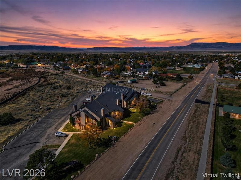 Discover an exceptional retreat at Shingle Brook Condominiums in Parowan, Utah, a fairy-tale base-camp on Southern Utah's alpine edge. This re-imagined property combines four original units into two expansive living levels, creating a versatile layout for gatherings & escapes. The entire lower level transforms into an immersive entertainment world, anchored by a gourmet chef's kitchen with a restaurant-style layout, ideal for intimate dinners or lively aprs-ski events. A convenient wet bar supports entertaining, while a dedicated movie theater offers cozy nights in. Unwind in the spa-inspired soaking tub area, a private sanctuary complemented by a dry spa & a luxury walk-in spa shower. Dual fireplaces grace each end of this level, filling the space with warmth and ambiance. The design harmoniously blends fairy-tale cabin charm with old-world Italian bistro elegance, featuring rustic wood beams, soft lighting, and alpine textures, creating the feel of a hidden mountain trattoria within a storybook lodge. Upstairs, the two top units are seamlessly connected into a single residential level, offering four bedrooms & four bathrooms. Cabin-inspired finishes create a warm & restful atmosphere. Two additional fireplaces provide cozy gathering points for snowy mornings & quiet evenings. Each side of the upper level includes a versatile loft space, perfect for ski gear storage, a home office, a reading nook, or a quiet retreat. These flexible areas are well-suited for full-time living, vacation use, or multi-family getaways. More than just a property, this is a true Southern Utah Base Camp for all seasons. World-class skiing & snowboarding at Brian Head Resort are just minutes away, & summer brings endless opportunities for fishing & kayaking at Yankee Meadow Reservoir. Whether it's ski weekends, lake days, or fireside evenings, this Shingle Brook retreat masterfully blends fairy-tale design, Italian-inspired warmth, & Southern Utah adventure into one unforgettable escape. Seller Financing Considered.