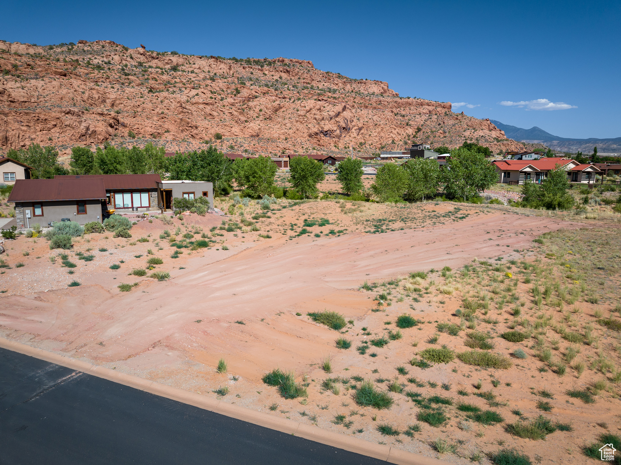 WHITE HORSE 12- All great adventures have a base camp... welcome to White Horse, Moab's truly original residential development designed for outdoor enthusiasts. Celebrate the beauty of Moab and all that the region has to offer, from mighty rivers to red rock canyons, slickrock formations to snow-capped peaks, and the very best of outdoor adventure. This lot has fantastic views of the rugged beauty that surrounds Spanish Valley, with peaceful starlit skies to take your breath away each night. Located in a cul-de-sac next to open space, this lot has an amazing setting. White Horse has been carefully designed to minimize traffic flow, sounds, and roadway views, located in a peaceful valley setting a perfect distance from the heart of town. The common area of White Horse show cases the natural high desert landscape, with hundreds of native plants, grasses, and trees. Utilities are in place, this lot is ready for you to build!