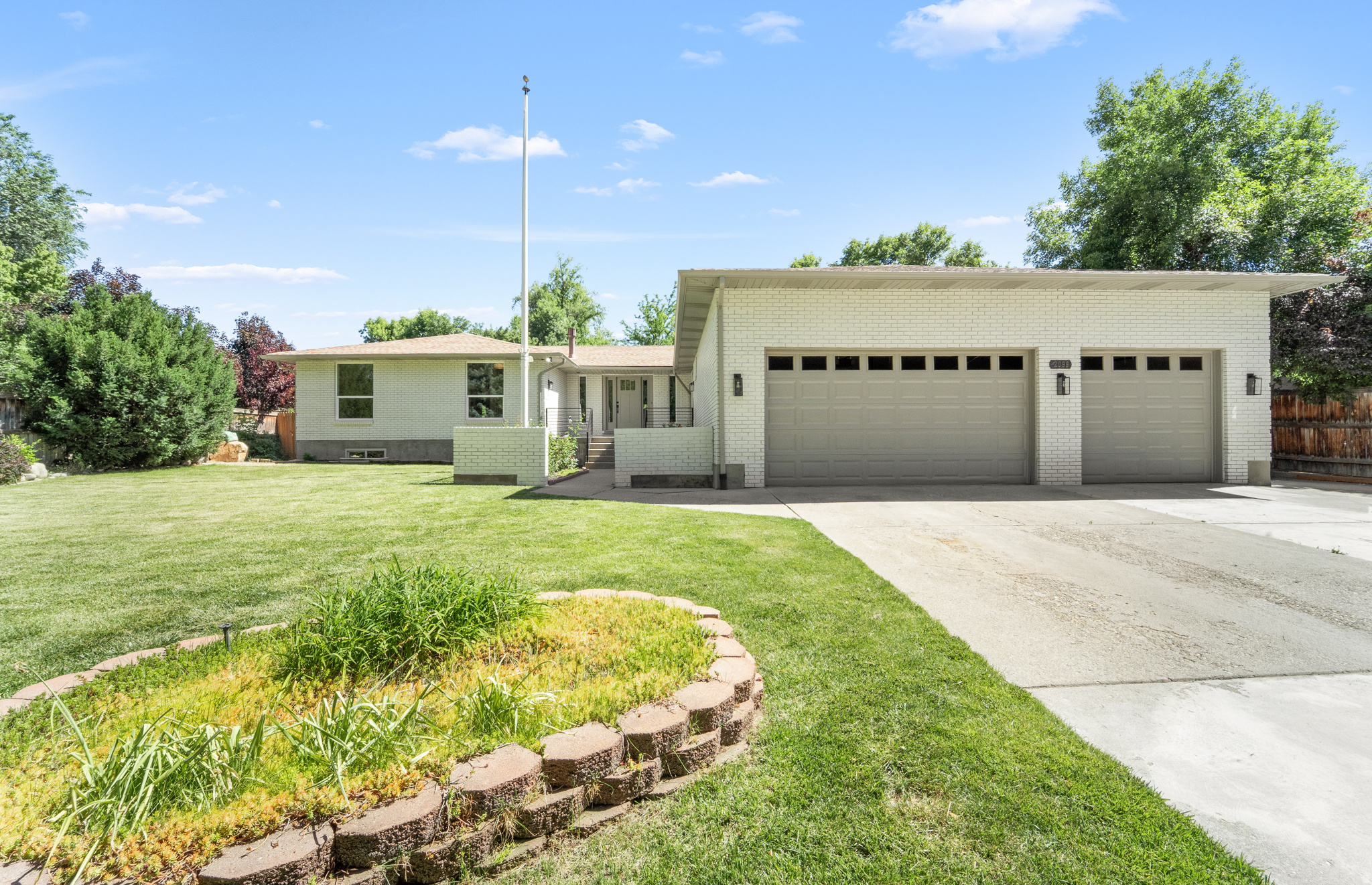 Welcome to this stunning, fully renovated Holladay estate where timeless design meets modern luxury. Offering 4,470 square feet of thoughtfully curated living space on nearly half an acre, this exceptional residence is tucked away on a private cul-de-sac surrounded by mature trees in one of Holladay's most coveted neighborhoods, providing a rare blend of privacy, tranquility, and convenience. Step inside to a light-filled open floor plan featuring wide-plank flooring, custom finishes, sophisticated lighting, and seamless indoor-outdoor flow. The heart of the home is a spectacular chef's kitchen featuring a 48-inch professional range, integrated refrigerator, pot filler, custom two-tone cabinetry, expansive quartzite countertops and island, butler pantry with a double oven, and abundant storage, perfect for both everyday living and entertaining. The luxurious primary suite serves as a private retreat, complete with a spa-inspired bathroom featuring dual vanities, a freestanding soaking tub, an oversized walk-in shower, and elegant designer finishes. Two additional main-level bedrooms are paired with a beautifully appointed bathroom that rivals a luxury hotel experience. Downstairs, enjoy exceptional flexibility with a fully finished lower level featuring a spacious family room centered around a cozy wood-burning fireplace, a wet bar kitchen, three additional bedrooms, and two bathrooms. Separate living spaces offer ideal accommodations for guests or the potential for a future accessory dwelling unit (ADU). Dual laundry rooms on both levels add everyday convenience. Outside, the expansive backyard offers a peaceful, private setting framed by mature trees, ideal for entertaining, recreation, or future customization. Additional highlights include an oversized 3-car garage, RV parking, generous storage, and an unbeatable location just minutes from top-rated schools, parks, shopping, dining, and mountain recreation. With its perfect blend of luxury, functionality, and location, this home presents an exceptional opportunity to enjoy the lifestyle you've always dreamed of. Don't miss your chance to make this Holladay masterpiece your own, schedule your private tour today. Square footage figures are provided as a courtesy estimate only and were obtained from county record. Buyer is advised to obtain an independent measurement.