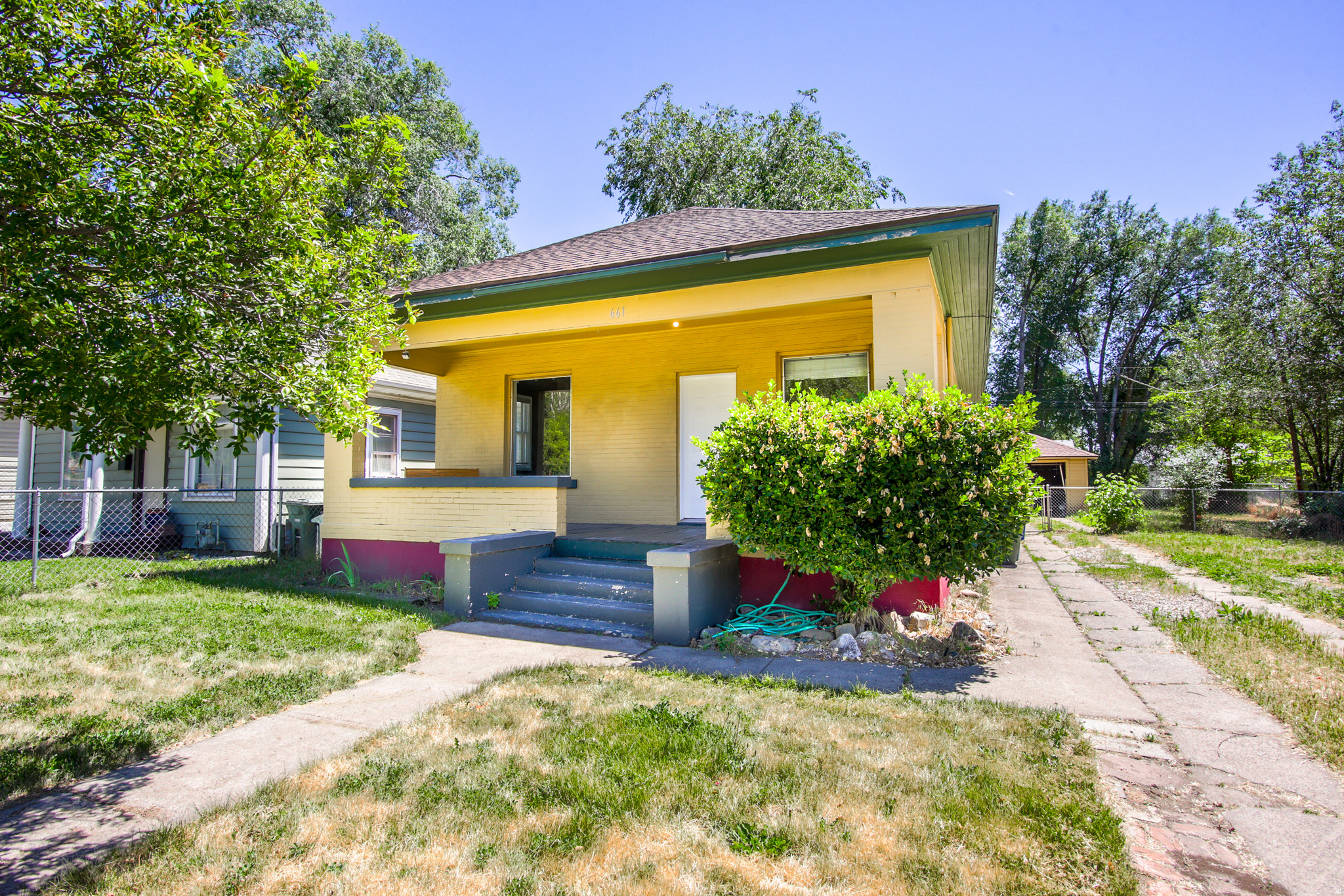 Charming Ogden bungalow with the heavy lifting done! Original Douglas fir flooring, nice appliances, updated electrical panel, mani-bloc updated plumbing, newer furnace, water heater and roof! A large and lovely front porch for hanging out - a perfect first-time homeowner house! Three bedrooms, two bathrooms, a spacious back deck, one car garage and a double lot! Plenty of room for RV and/toys! Mature trees shade the back yard!  Ready for you today!