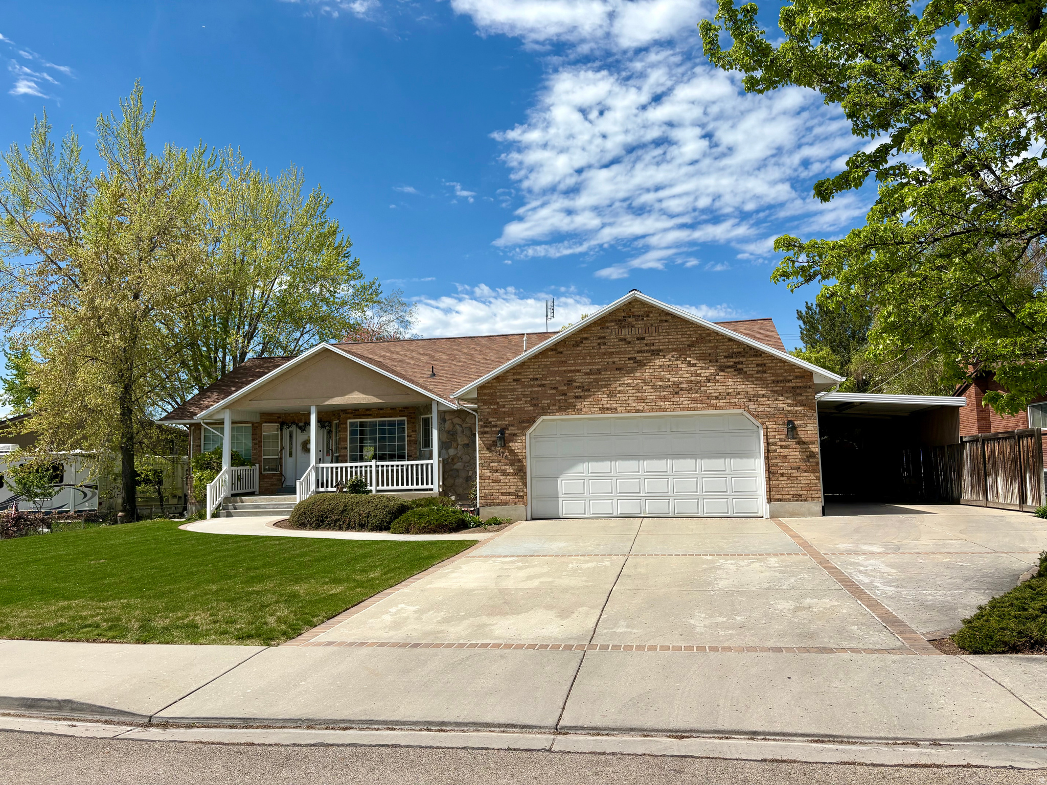 AMAZING 1 OWNER METICULOUSLY CARED FOR HOME, Fully BRICK! MAIN LEVEL LIVING! Large KITCHEN w/ISLAND and BUFFET flows nicely into the LARGE FAMILY ROOM! 2 BEAUTIFUL STONE FIREPLACES!  PRIMARY SUITE w/ UPDATED BATHROOM w/Separate TUB & SHOWER!  LOOKING FOR A HOBBIE ROOM, this home has it too!! DON'T WAIT!! THERE IS MORE!!! HEATED DETACHED ALL BRICK SHOP makes a hard to find 3rd CAR GARAGE!!  NOW Let's Talk about the PRIME CULDESAC LOCATION!! Especially RARE on the GRANDVIEW BENCH w/INCREDIBLE VALLEY & MOUNTAIN VIEWS! WOW!! PARK-LIKE Mature Landscaping in the FRONT & BACKYARDS!  DEVELOPED & MANICURED for MANY YEARS so it will be easily ENJOYED in the future! COVERED DECK & PATIO in the BACKYARD, Ideal for RELAXING & GATHERINGS. The ALL-BRICK GARDEN BOXES each have their OWN WATERING SPOUTS & have grown MANY GARDENS over the years!  FIREPIT AREA, ADORABLE PLAYHOUSE & PERIMETER SIDEWALK situated in the Backyard for LOTS OF FUN!!  THE EXTRA CONCRETE DRIVEWAY w/CARPORT is for sure a PLUS for your RV & TOYS!  NICELY FENCED w/GATE & ACCESS to the SHOP from the Back too!  New ROOF 2017!  New AC/FURNACE 2023! New WATER HEATER 2025! Don't Delay!!