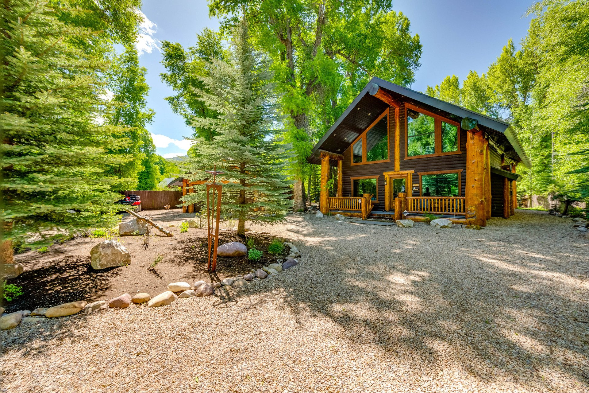 Riverfront luxury meets mountain escape in this one-of-a-kind Weber River retreat. Designed for entertaining, relaxing, and making unforgettable memories, this exceptional property offers everything you've dreamed of in a mountain cabin getaway. Enjoy your own private fisherman's paradise with direct Weber River frontage, an aerated trout pond with continuous fresh water, and a stunning riverside gazebo complete with a propane fireplace, built-in lighting, and outdoor speakers overlooking the river - the perfect setting for gatherings with family and friends. Inside, no detail has been overlooked. This top-of-the-line cabin features whole-home audio with 12 indoor and outdoor speakers, air conditioning, granite finishes, central vacuum, water softener, humidifier, bidet toilet, beautiful scribed wood interiors, and energy-efficient LED lighting throughout. Furniture and furnishings are included, making this a truly turnkey retreat. Step outside and unwind in the hot tub while taking in the peaceful riverfront setting. The heated garage includes an opener, extra refrigerator, and freezer, while the fenced yard features mature trees, abundant parking, and room for RVs. Commercial-grade weed barrier beneath the property keeps the grounds beautifully maintained and low maintenance. This is one of the few communities in the area that allows short term rentals for investment potential.  Conveniently located near the main electric gate for easy access, this incredible property is just minutes from Smith and Morehouse Reservoir and only about 25 minutes from Park City. Experience the ultimate blend of luxury, recreation, and mountain serenity on the Weber River.