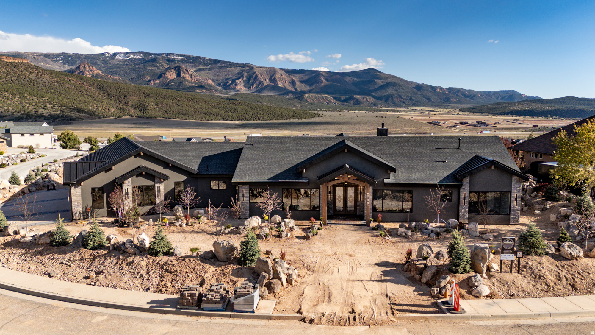 This one of a kind custom luxury home is near finished and ready to view. See 180-degree views of Shurtz Canyon & mountains, plus the spectacular hilltop lot, create a setting that few homes can compete with in Cedar. NO HOA! Kitchen has exquisite stone & live edge wood counter, a stone sink, Wolf & JennAir appliances, a 140 sf butler's pantry; there is a built-in safe in the office, a master suite w/fireplace, soaker tub, amazing walk-in closet, & private access to patio. There is a grand entry & beamed ceilings w/unobstructed views, a fireplace, floor to ceiling glass panels that open for indoor-outdoor living, a formal dining room. A 5-car garage w/separate 2-car heated & cooled man-cave/shop + 100'x30' RV storage w/hookups off a lower driveway. Ask your agent for a features flyer.