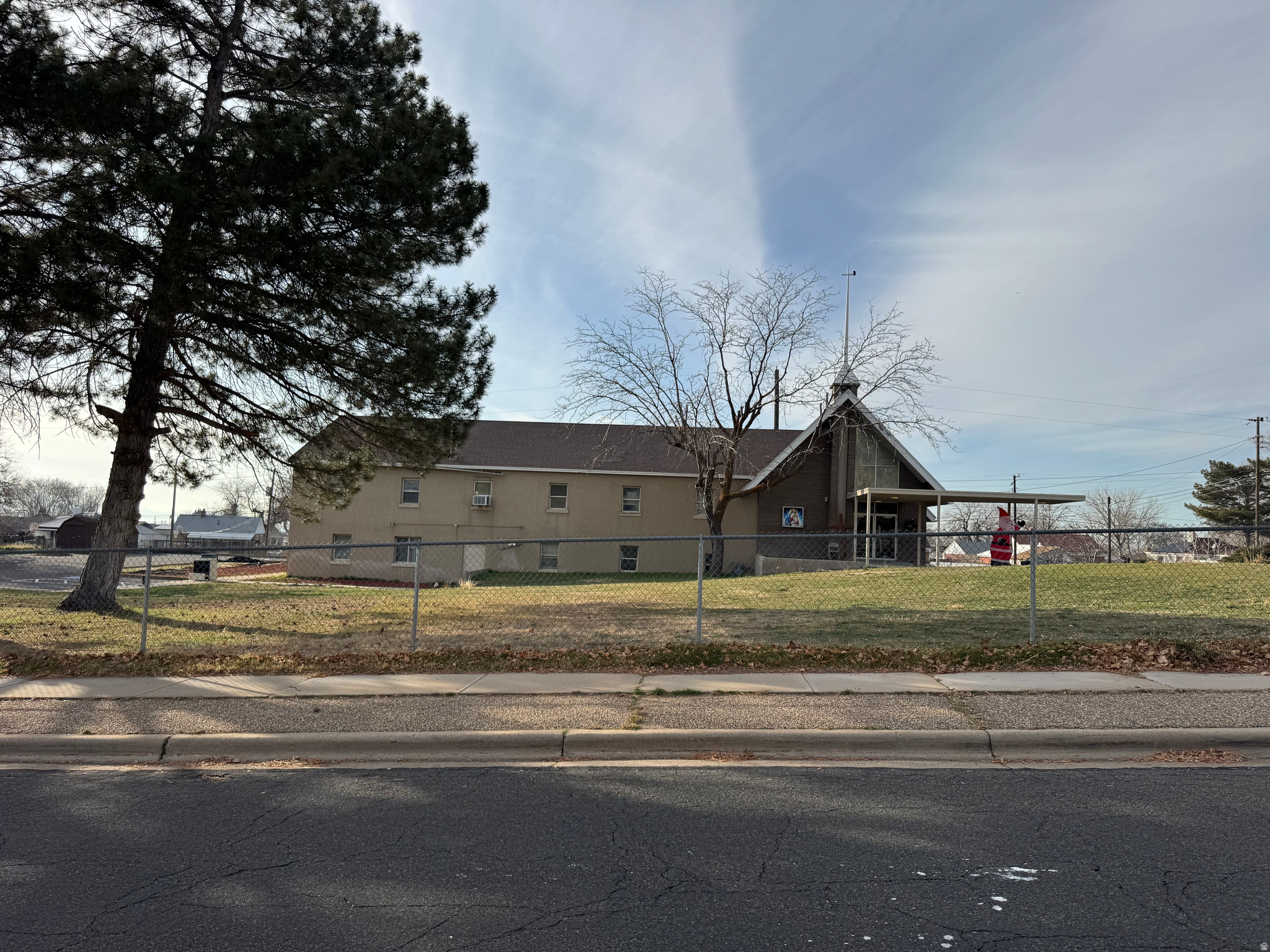 Rare opportunity! 2.25 acres with 7,868 square foot church and school building. Zoned R-1-6,meanbing Residential, Single Family, minimum of 6,000 square foot lot size. So this property could hold up to 11 single family residential building lots with city approval. Parcel numbers 120180005, 120180006, 120180007, and 120040172 included in listing.