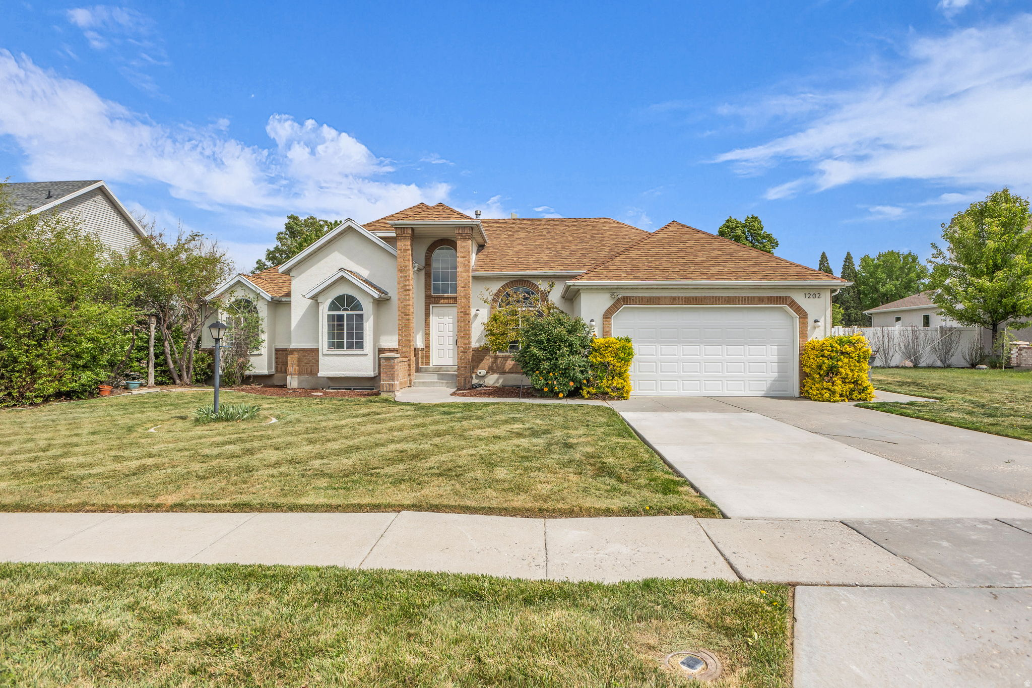 South-facing rambler sits on a huge lot (0.41) in a very desirable and rarely available neighborhood.  Just minutes to the Jordan River trail system. Exterior of home is freshly painted. The main great room offers tall, vaulted ceilings, remodeled bathrooms, updated lighting,  solid surface flooring throughout. The open-concept kitchen has been updated with new lighting, backsplash, and shelving, and features granite countertops. Dining area has access to the New Back Deck Overlooking the Sprawling Fully Fenced & Landscaped Backyard. As with the upstairs, the basement offers a gas  fireplace located in the large living room. Both basement bedrooms have walk-in closets. The basement offers, updated lighting,  newer flooring, Updated stunning bathroom, and a large storage room. In the backyard you find endless possibilities. There's plenty of room for a pickleball court, a pool, or whatever you dream of. The backyard was recently updated with new pergolas & a fire pit. The side yard has 11 ft wide access if you desire to build a future dethatched garage. Located in the boundaries of the top-rated schools.* New superior water/air softener *New Garage Door*
