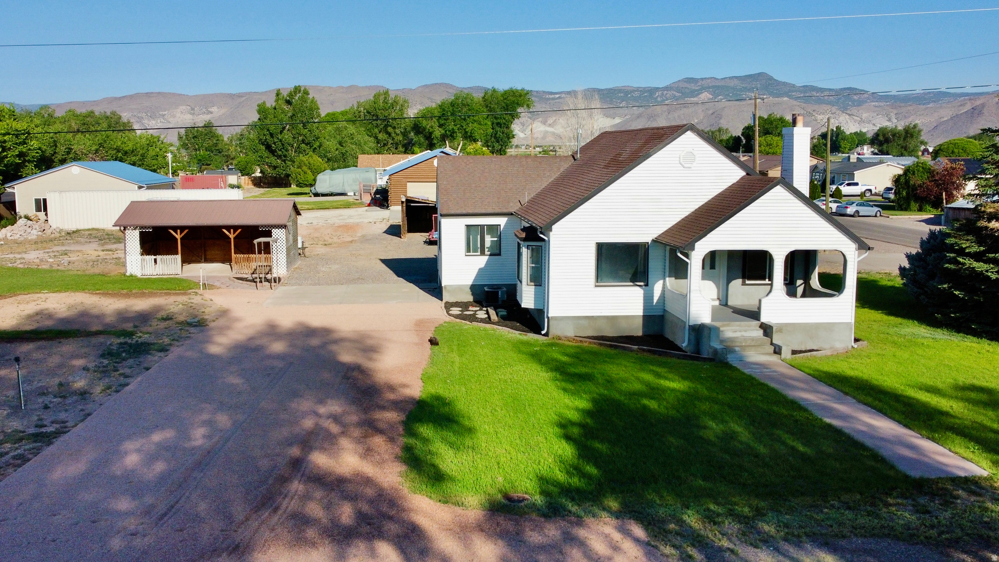 Charming home in the desired town of Central Valley. This home sits next to the city park, splash pad, community center and LDS stake center. This home has just been updated through out and added a 4th bedroom and another full bath. New A/C unit added in June, 2026. There are an abundance of parking stalls with the extra out buildings and a one car detached garage and work shop. Yard is fully landscaped with automatic sprinklers and a large garden area. Separate detached patio area has great views of Cove Mountain and will be fun for entertaining. Buyers and agents to verify all listing information.