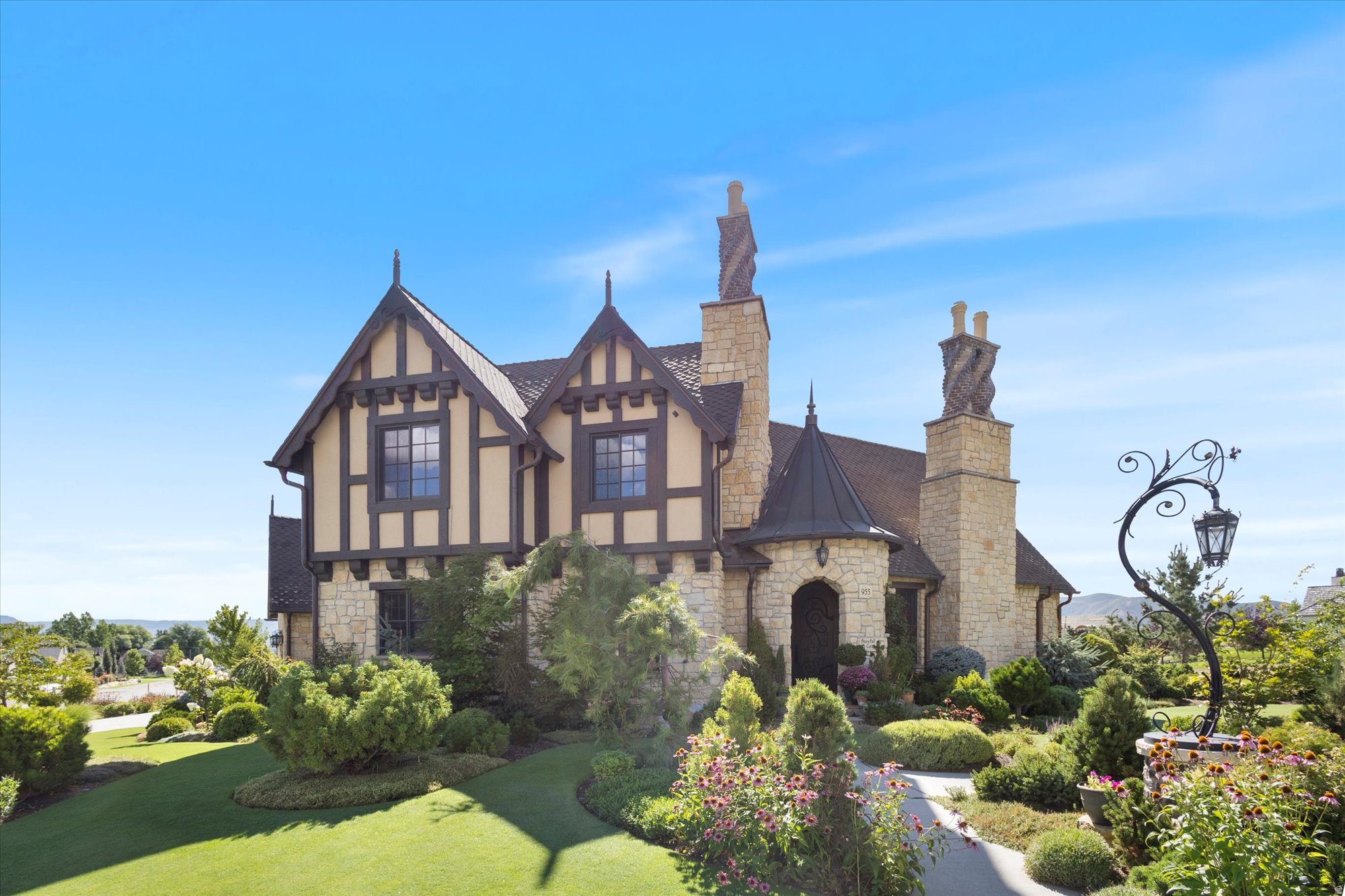 Timeless European Luxury. Nestled in the coveted Cascades at Soldier Hollow in Midway, Utah, this extraordinary residence showcases timeless Normandy-inspired architecture paired with exceptional craftsmanship throughout. A striking copper turret roof, along with matching gutters and downspouts, sets the tone for the home's distinctive character, complemented by full bed stone construction and beautifully twisted brick chimneys. Inside, every detail has been thoughtfully curated, from the hand-carved Venetian plaster entry to the four stunning masonry fireplaces that add warmth and elegance throughout. The gourmet kitchen is a chef's dream, featuring premium Thermador appliances, twin dishwashers, and exquisite Rohl fixtures. In this cozy cottage authenticity and artistry shine with handmade clay tile imported from England and a classic clawfoot tub that enhances the home's refined charm. Every element of this residence has been custom designed, creating a one-of-a-kind living experience that blends luxury, comfort, and architectural beauty. This is truly luxury living at its finest in one of Midway's most sought-after communities.