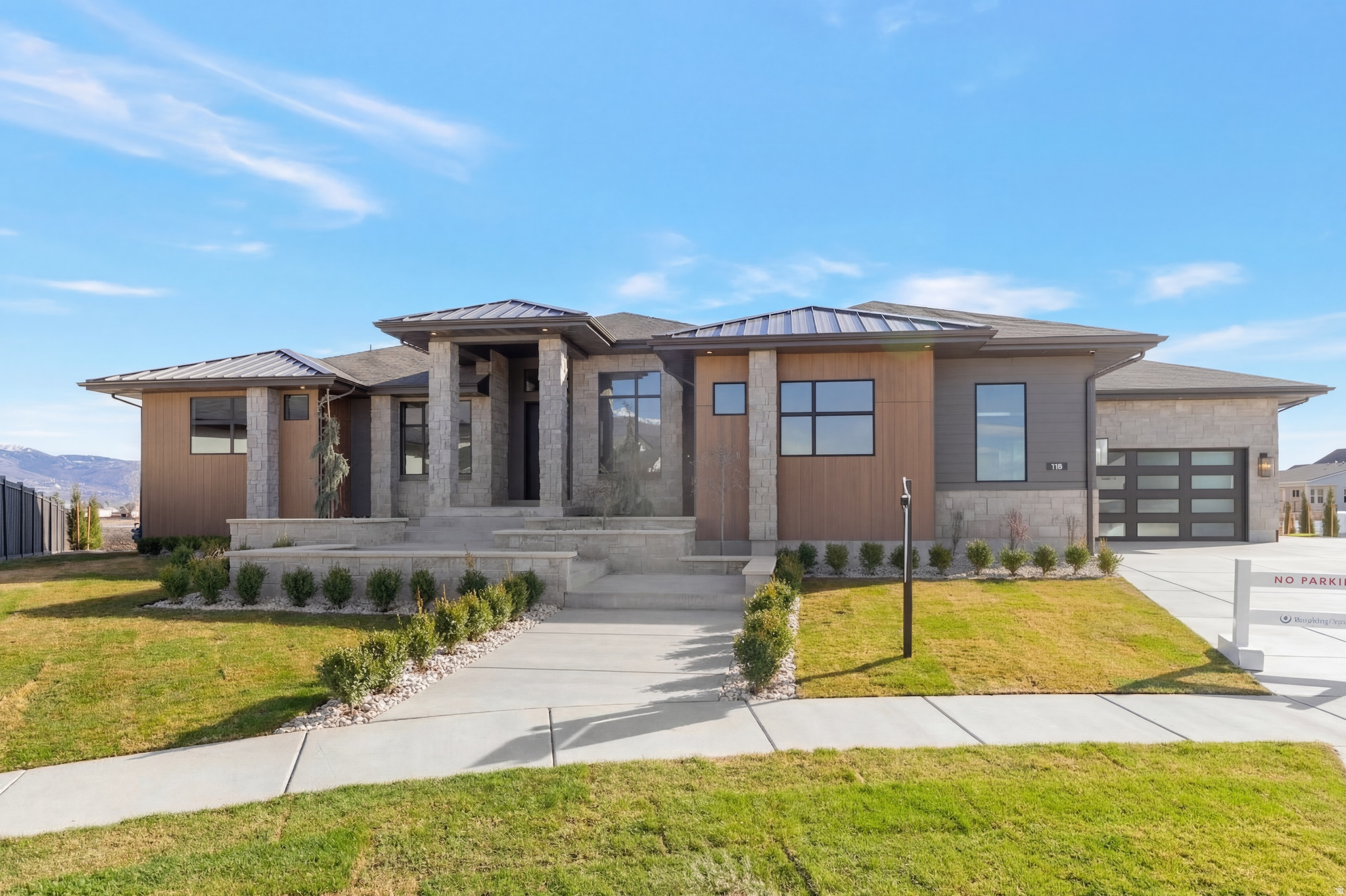 LOT#513. This thoughtfully designed "Adagio" plan home features a luxurious main-floor primary suite with decorative tray ceiling, custom millwork and cabinetry, a cozy sitting area with fireplace, an impressive spa-style bathroom with a huge walk-in shower, and a spacious custom wardrobe room complete with a stackable laundry hookup for convenience. Both a flex room and an office greet you at the entry before opening into the impressive great room. The kitchen is beautifully appointed with high-end appliances, built-in column fridge and freezer, a large butler's pantry, and a convenient pocket office (or craft room). The dining nook flows seamlessly to the covered deck, creating an ideal indoor/outdoor living space. The fully finished basement offers three additional bedrooms, two bathrooms, a huge laundry room, an open game room, a stylish wet bar, and walk-out access to a covered patio. Additional features include a cold cellar, active radon mitigation system, and a 4-car finished garage. A stunning blend of craftsmanship and comfort-don't miss this one.