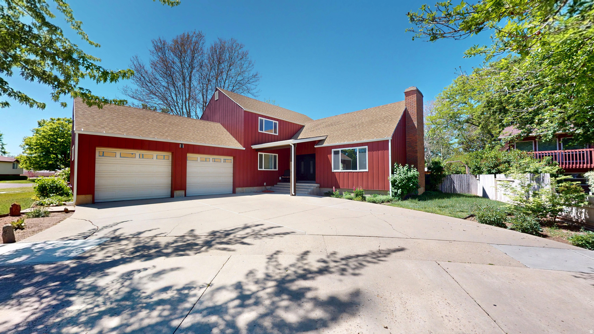 This 4-bedroom, 2-den, 3.5-bath home sits on a secluded Roy corner lot, combining high-end renovations with easy access to I-15 and I-84. Large double front doors open into a spacious living room, setting a tone of scale that continues through the generously sized bedrooms and two large family rooms. Five fireplaces are featured throughout the home, including one in the expansive master suite which also offers a private deck. Recent upgrades include new smart siding, energy-efficient vinyl windows, stone countertops, new paint, beautiful trim, and premium carpet. The layout is designed for flexibility and entertaining, offering two dens and a main-level salon space for a home-based business. The yard is landscaped and the backyard is fenced. Located minutes from Hill Air Force Base and the Roy Aquatic Center, the property is also within 30 minutes of Snowbasin Resort and mountain recreation.  Square footage figures are provided as a courtesy estimate only and were obtained from a listing appraisal. Buyer is advised to obtain an independent measurement.