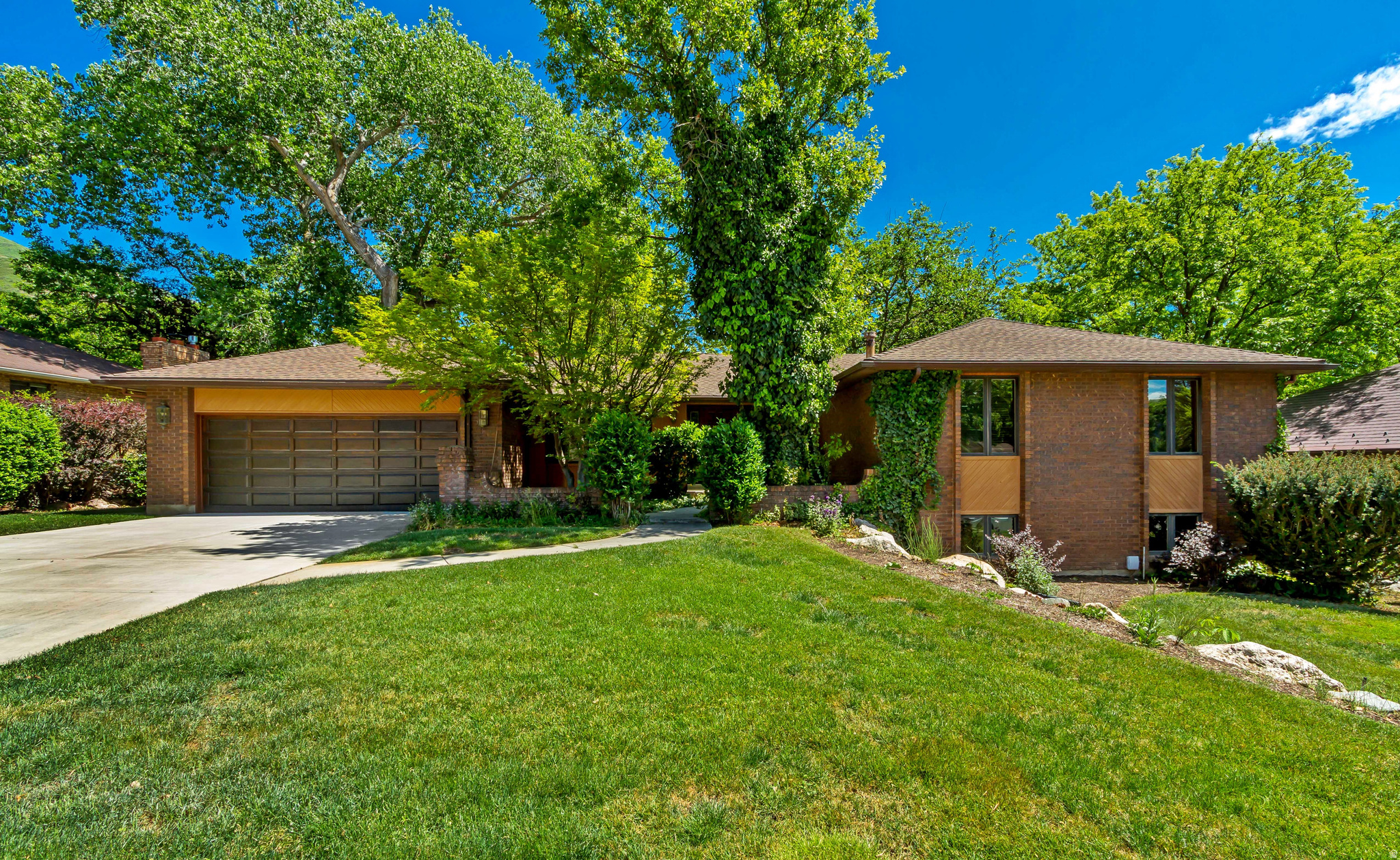 Welcome to this nicely maintained, 4-bedroom, 3-bathroom 3,700 SF brick rambler in the highly sought-after Shadow Valley neighborhood.  Full of timeless craftsmanship and design.   Featuring a full-length rear deck with three separate entrances and a covered area for relaxing.   Mature, manicured landscaping and a secluded backyard.  Main-floor primary bedroom complete with a private en-suite bath and its own access to the deck.  Large main-floor laundry.   Spacious lower level with a walkout, perfect for entertaining guests.  Huge workshop/craft area.   Updated hardwood and plush carpet upstairs.  Two furnaces.  Newer roof and 2026 water heater.