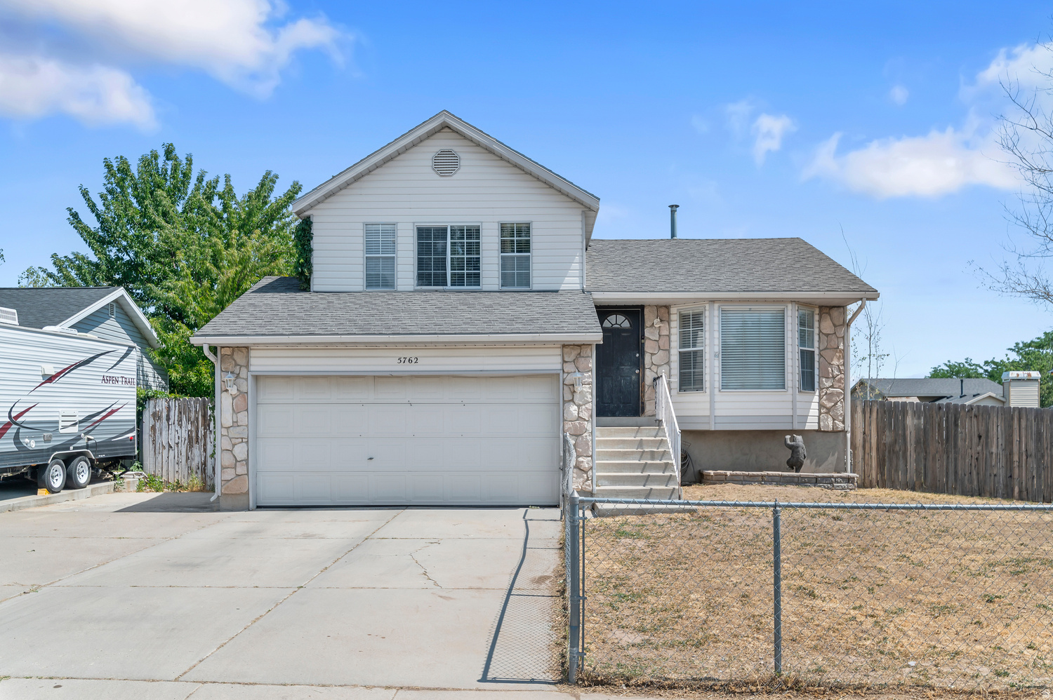 Great opportunity to own a spacious home with room to grow in a convenient West Valley location! This 4-bedroom, 2-bath home offers a functional layout with multiple living spaces, providing flexibility for everyday living, entertaining, or working from home. The bright kitchen opens to the dining area, while large windows throughout bring in plenty of natural light.  Step outside to a fully fenced backyard with mature trees, offering privacy, shade, and plenty of space for kids, pets, gardening, or future landscaping projects. An attached 2-car garage and extended driveway provide ample parking and storage.  Conveniently located near parks, schools, shopping, dining, and freeway access, this home offers an excellent opportunity for buyers looking to personalize a home and build equity in an established neighborhood. Don't miss your chance to make it your own!