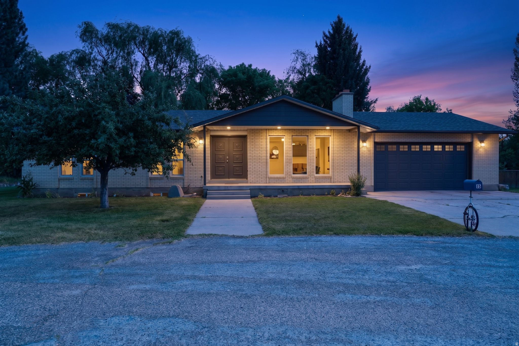 Welcome to your own private retreat on the Weber River! Nestled at the end of a quiet cul-de-sac subdivision, this stunning 5-bedroom, 3-bathroom brick home offers 2,918 sq ft of comfortable living space plus a rare combination of mountain views, water views, and true waterfront access, all on a secluded .32-acre lot. From the moment you arrive, the lush, mature landscaping sets the tone featuring majestic trees, a vegetable garden, and a fully irrigated yard with automatic sprinklers. Whether you're relaxing on the covered patio or soaking in the open-air space by the river, the serene surroundings create a one-of-a-kind outdoor living experience.  Inside, the thoughtfully updated kitchen shines with quartz countertops. All bathrooms have been beautifully updated with showers and/or bathtubs and surrounds. The finished full basement expands your living and storage options dramatically, while the oversized attached garage features extra width, extra length, an automatic opener, and room for your RV. This home has new windows and new roof as of April 2026.