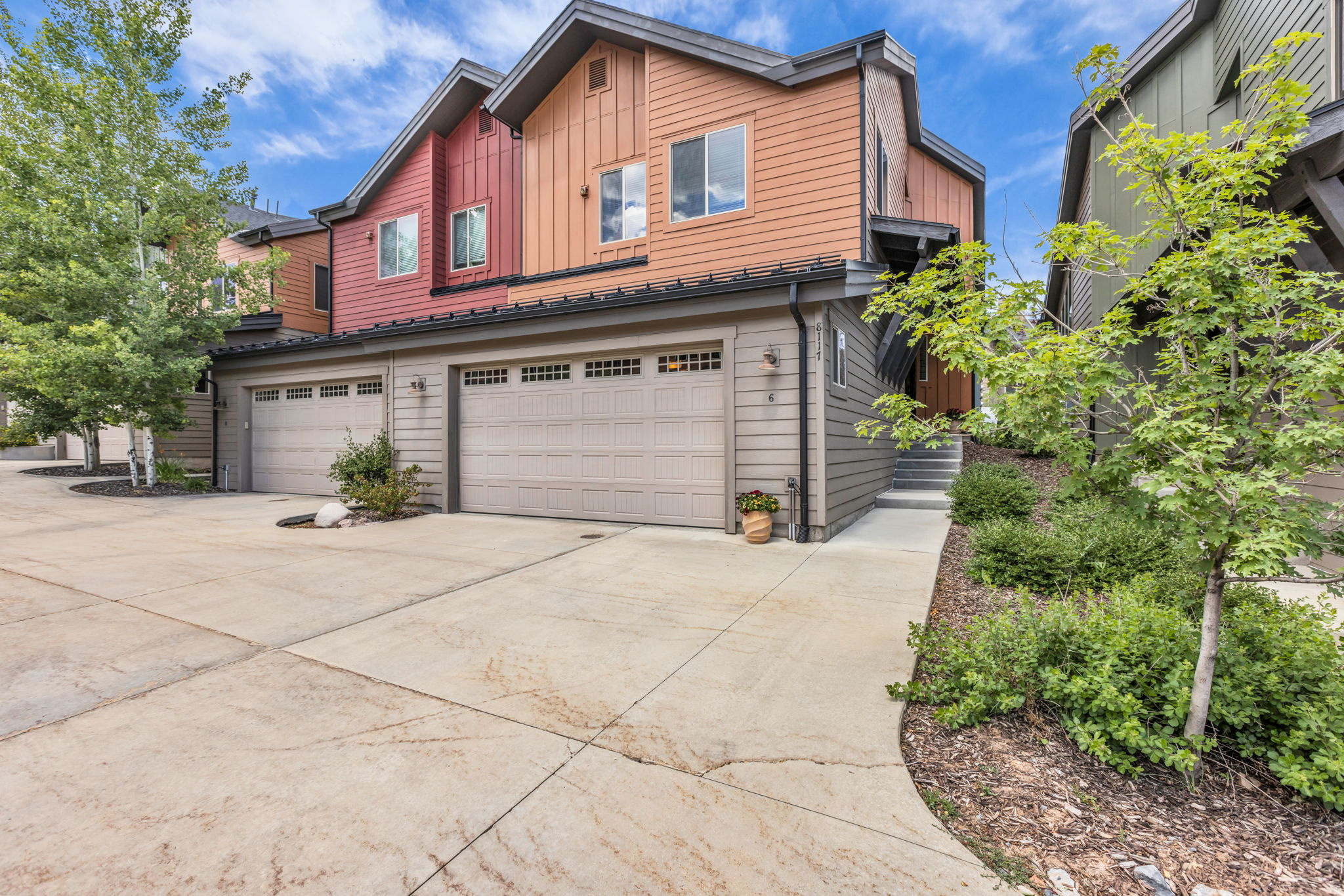 Perfectly positioned in the sought-after Courtyards at Quarry Village, this beautifully updated contemporary townhome combines an exceptional location, stylish finishes, and outstanding investment flexibility. Just minutes from Park City's world-class ski resorts and historic Main Street, with quick access to I-80 and only 30 minutes from Salt Lake City International Airport, you'll also enjoy the convenience of walking to grocery shopping, Starbucks, restaurants, live music, fitness studios, community parks, trails, and everyday services. Inside, the open-concept floor plan is enhanced by soaring vaulted ceilings and expansive windows that fill the home with natural light. Warm wood flooring, a welcoming gas fireplace, and thoughtfully designed living spaces create an inviting atmosphere ideal for both everyday living and entertaining. The kitchen has been beautifully refreshed with quartz countertops, a glass tile backsplash, and like-new stainless steel appliances. Sliding glass doors from the dining area open to a spacious deck, creating a seamless indoor-outdoor flow for grilling, dining, and relaxing. The spacious primary suite offers a peaceful retreat with a walk-in closet and private deck, perfect for enjoying your morning coffee or unwinding in the evening. Two additional generously sized bedrooms provide flexibility for guests, a home office, or additional living space. An oversized two-car attached garage offers abundant storage for vehicles, skis, bikes, and outdoor gear. Whether you're looking for a full-time residence, mountain getaway, or income-producing property, this home offers the rare advantage of both short-term and long-term rental opportunities in one of Park City's most convenient locations. Experience the perfect balance of mountain recreation, everyday convenience, and comfortable contemporary living.