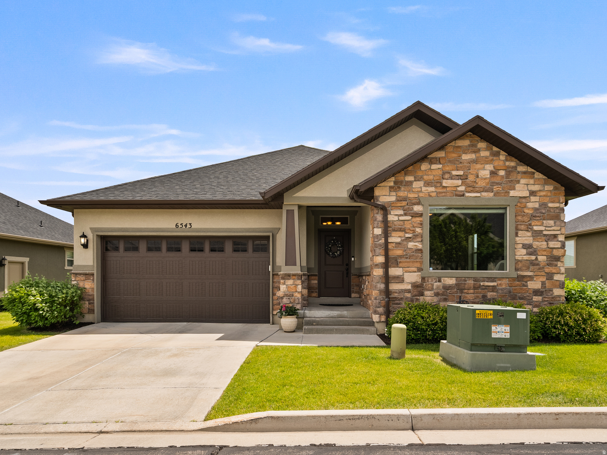 Welcome to coveted Stirling Pointe at Skye Estates, a premier 55+ active community offering truly low-maintenance living that allows for 20% non 55+ buyers in hopes to bringing young families to the neighborhood. One of the few freestanding homes in the neighborhood, this beautiful rambler provides added privacy while the HOA takes care of all landscaping and snow removal.  Designed for both comfort and accessibility, the home features 36" doorways on the main level. The open floor plan is filled with natural light and showcases 10-foot tray ceilings, a dedicated office with built-ins, and a spacious great room with a cozy gas fireplace.  The impressive chef's kitchen is the heart of the home, featuring an enormous granite island, double ovens, gas range, abundant cabinetry, and a large pantry. The grand primary suite offers a spa-like bath, walk-in closet, and walk in shower with separate bath.  The fully finished basement provides exceptional flexibility with two bedrooms, a full bath, family great room.  Additional features include a high-efficiency furnace, water softener, radon mitigation system, fenced yard, covered patio with pergola, insulated 2-car garage with 220V outlet for EV charging, and abundant storage.  This home combines quality, functionality, and easy living in one of Highland's most desirable active-adult communities.