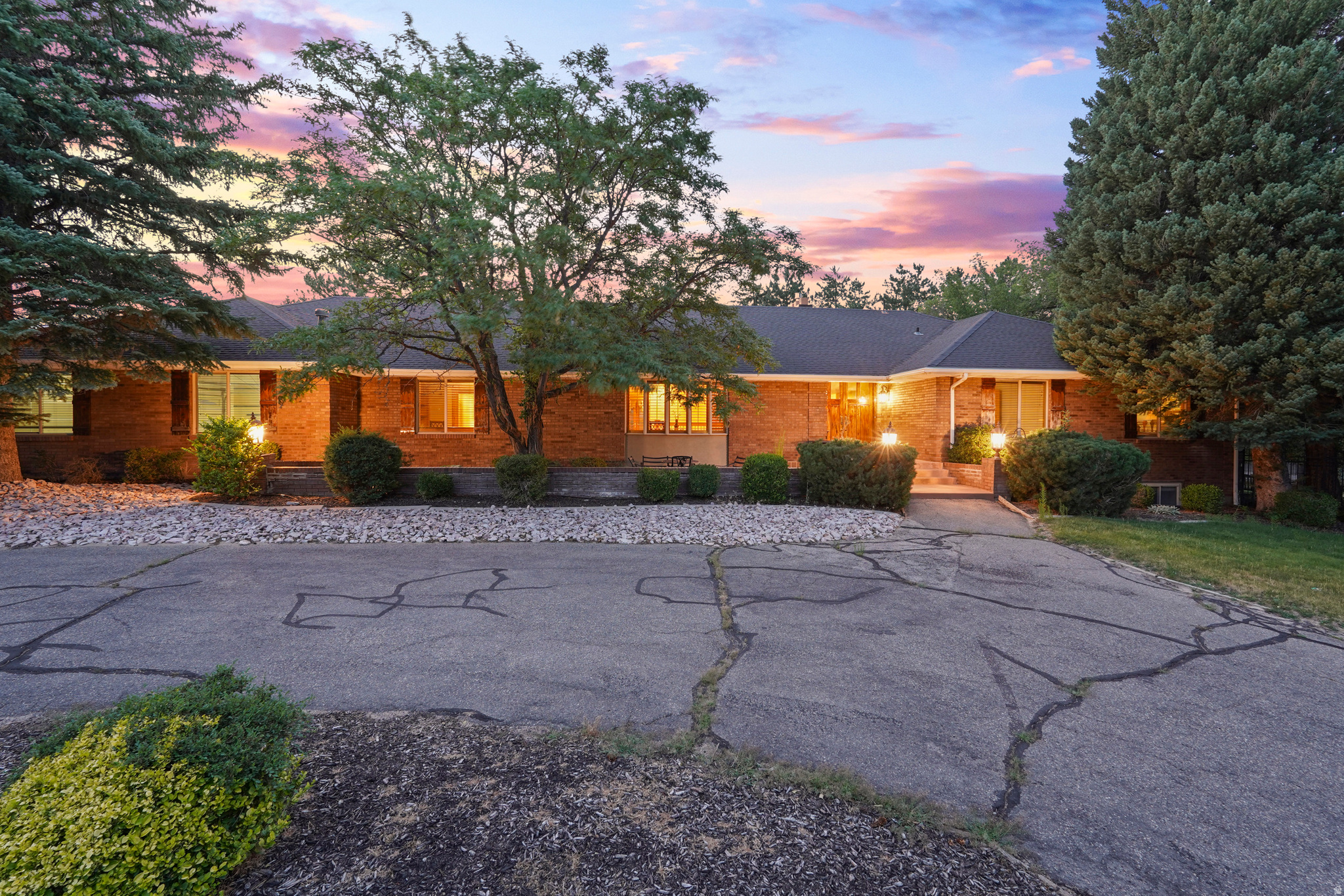 Experience elevated living in the prestigious Pepperwood community with this beautifully renovated home offering 5 bedrooms, 4 bathrooms, a home theater, dedicated gym, and two expansive recreation rooms. Designed for both everyday comfort and exceptional entertaining, the spacious single-level floor plan features soaring ceilings, oversized rooms, abundant natural light, and breathtaking mountain views throughout. A comprehensive renovation transformed the home with all new plumbing, electrical systems, cabinetry, flooring, and premium appliances. The gourmet kitchen is a chef's dream, featuring a Viking gas cooktop, JennAir oven, Monogram refrigerator with ice dispenser, generous workspace, and quality finishes throughout. The spacious primary suite provides a private retreat and features a luxurious ensuite bathroom complete with a relaxing steam shower. Additional highlights include an oversized garage with a separate storage room, convenient basement access through the garage, RV parking, a large circular driveway, and a tool shed providing exceptional storage and functionality. The beautifully landscaped, fully usable lot is one of the largest in Pepperwood and showcases mature trees, an in-ground basketball hoop, tetherball area, and expansive outdoor spaces perfect for entertaining, recreation, or simply enjoying the spectacular mountain views. Ideally situated on one of Pepperwood's most desirable streets, this home is directly adjacent to the community amenities, allowing children to walk to the recreation areas without crossing any streets. Pepperwood is one of Salt Lake County's premier 24-hour guard-gated communities, offering an unmatched lifestyle with a resort-style swimming pool and spa, elegant clubhouse, six lighted tennis courts, pickleball courts, basketball courts, sand volleyball courts, soccer field, multiple parks and playgrounds, and miles of scenic walking and biking trails. The community is also just minutes from Little Cottonwood Canyon, providing quick access to world-class skiing at Snowbird and Alta, as well as hiking, biking, shopping, dining, top-rated schools, and convenient freeway access. This exceptional property offers a rare combination of privacy, space, craftsmanship, and convenience in one of Sandy's most sought-after neighborhoods. A truly remarkable opportunity to own one of Pepperwood's finest homes. Square footage figures are provided as a courtesy estimate only and were obtained from an appraisal sketch. Buyer is advised to obtain an independent measurement.