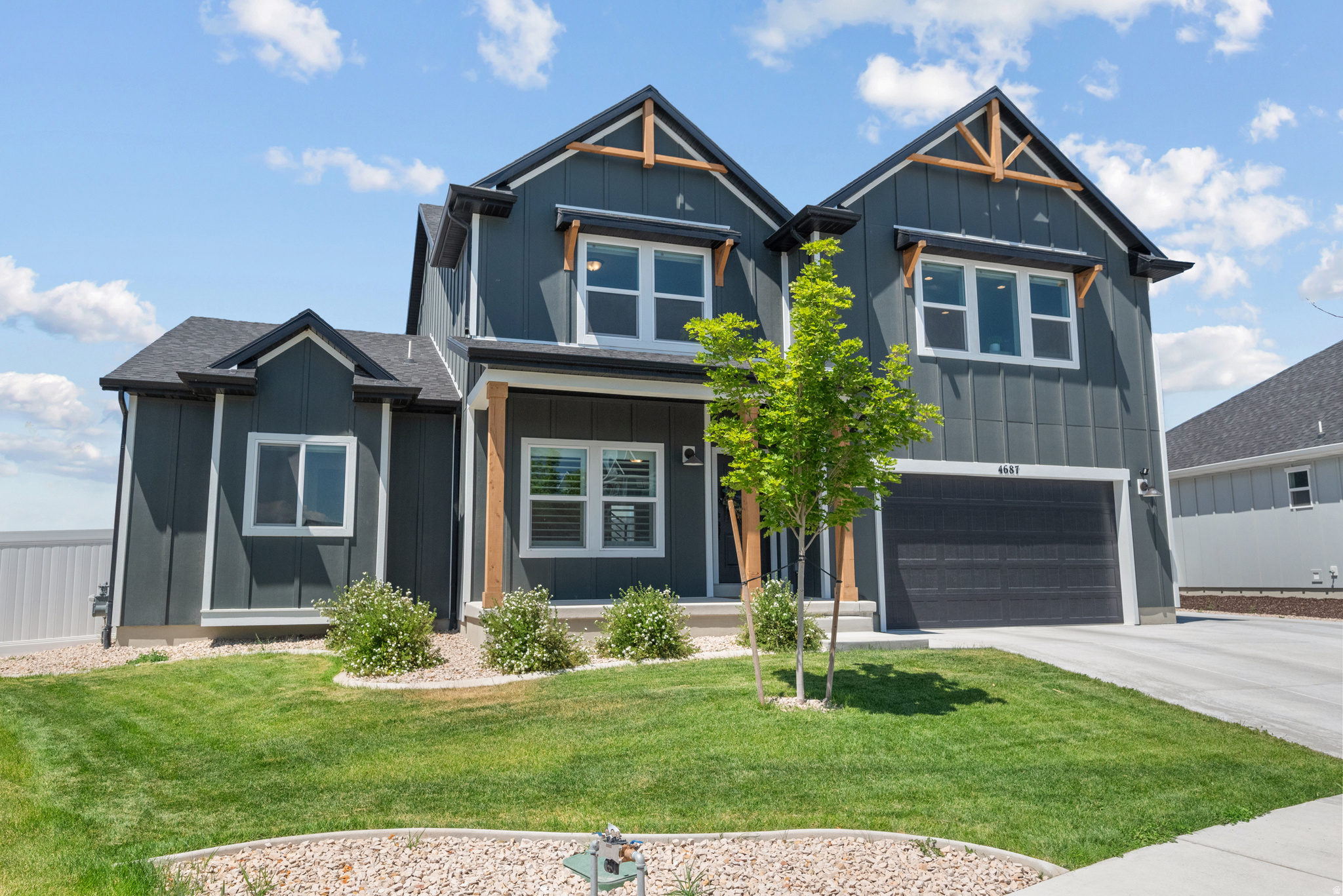 Imagine moving into a brand-new home where everything is already finished. The backyard is complete, the patio is ready for summer BBQs, the pergola is waiting for quiet evenings on your 0.35 acre lot, and the mountain views are yours from the moment you unpack. That's exactly what this home offers. BEAUTY: Every detail of this home was selected to match the builder's Uinta model, creating a timeless and elevated feel throughout. The dramatic vaulted ceilings and expansive windows flood the great room with natural light, while upgraded lighting, designer finishes, and the stunning fireplace create a warm gathering space. Take in the mountain views from a professionally finished backyard then step into a Chef's Kitchen designed for gathering, entertaining, and everyday living. Featuring quartz countertops, an oversized island, double wall ovens, a gas cooktop, premium cabinetry, and upgraded finishes throughout. FUNCTIONALITY: Designed with everyday living in mind, the main-floor primary suite provides convenient single-level living with a massive suite, and walk-in bathroom with an overside shower. Upstairs offers three additional bedrooms and an oversized bonus room that's perfect for movie nights, a game room, play area, or a second family room. Throughout the main living areas, you'll appreciate the upgraded scratch- and water-resistant flooring that provides both durability and style-ideal for busy households, kids, pets, and everyday life. With over 5,100 square feet, there's room for everyone, while the unfinished basement gives you the opportunity to build equity and create the space you've always wanted. Outside, the oversized concrete RV parking provides extra space for your RV, boat, trailer, or additional vehicles-a feature that's increasingly hard to find in newer communities. LOCATION: Enjoy the neighborhood clubhouse, pool, fitness center, and included high-speed internet through the HOA. Macey's, restaurants, and everyday shopping are just down the street, while Eagle Mountain's endless parks, walking trails, biking trails, and mountain views make it easy to enjoy the outdoors year-round. The best homes aren't just beautiful-they make life easier. This one already has the upgrades, the finished backyard, and the spaces where your favorite memories will be made. All you have to do is bring your furniture and start enjoying it.