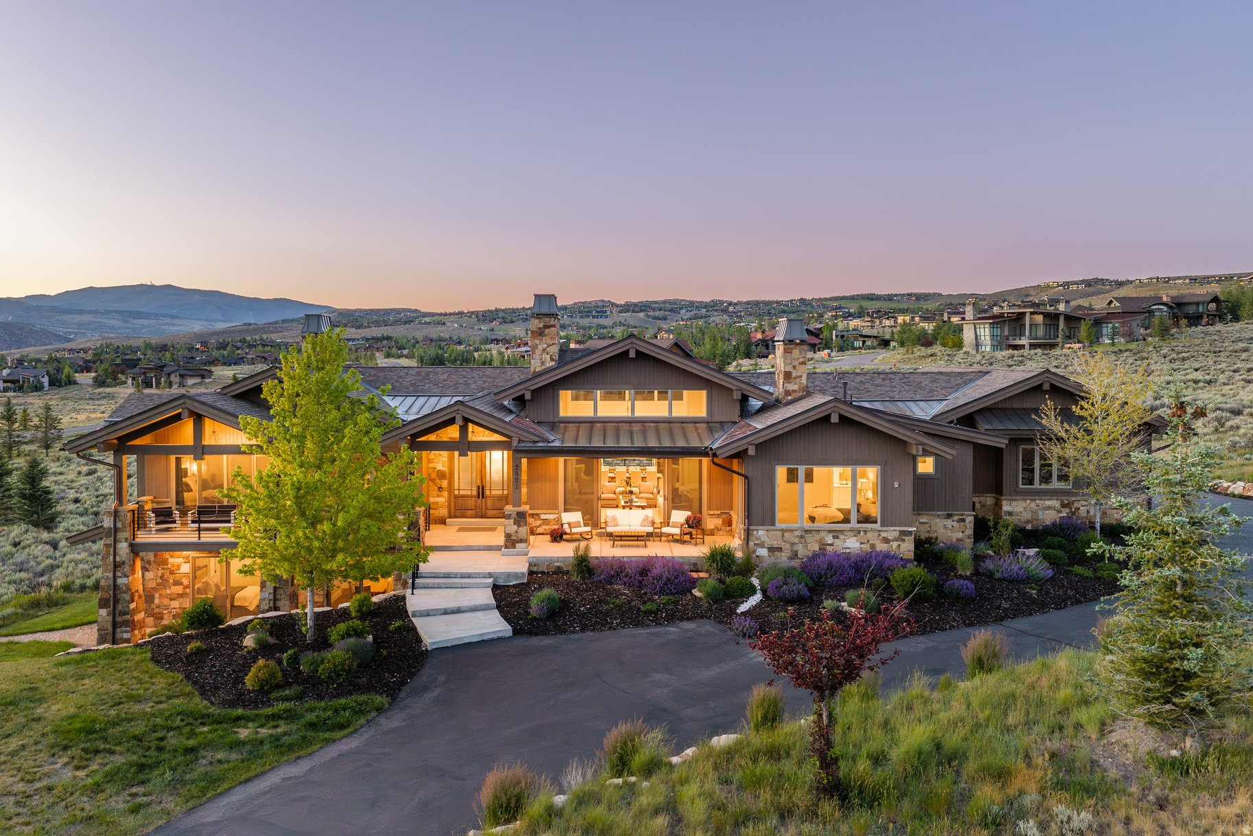 Full Promontory Golf Membership Available! Looking for the ultimate place to call home? This impressive property in Promontory greets you with a charming front porch and a large yard adorned with vibrant flowers, creating a welcoming atmosphere as soon as you pull in the driveway.  This property enjoys breathtaking views of nearby ski slopes and golf courses, providing striking views from every window. Inside, warm, natural materials create an inviting ambiance with warm wood and stone. The open floor plan blurs the lines between indoor and outdoor areas, with a sophisticated living room that opens to the front porch, a kitchen that flows to the dining room, and a dining room that flows to the deck for prime sunset watching. The main level hosts a spacious master suite and a luxurious guest suite, offering comfort and privacy for you and your favorite visitors. His and hers master closets and vanities are not just a luxury, they're a necessity! A lower walkout level includes an impressive family room equipped with a wet bar and game tables, so you can entertain a houseful of guests and family. For cinematic experiences at home, the theater room promises countless hours of enjoyment, whether you are watching thought provoking films, action flicks, or your favorite sports teams. One of the standout features of this home is its proximity to an extensive network of miles and miles of hiking and biking trails, perfect for outdoor enthusiasts seeking adventure right out their doorstep. Avid golfers will appreciate having three pristine golf courses available with the available full golf membership, as well as Promontory's many swimming pools, clubhouses and restaurants. The new Hills Course and Clubhouse with its welcoming bar and outdoor dining patio is just moments away. The friendly neighborhood fosters community spirit while still allowing for personal retreat within the expansive grounds. Additionally, practical amenities such as a large three-car heated garage, two laundry areas and a butler's pantry enhance daily living convenience without compromising style or comfort. The four fireplaces scattered throughout the home add warmth, creating cozy retreats after spending time enjoying Utah's best snow of earth. Park City itself is renowned not only for its world-class skiing but also for its vibrant arts scene, eclectic dining options, and year-round recreational activities. Residents can indulge in boutique shopping along Main Street or savor culinary delights prepared by acclaimed chefs in local restaurants. With numerous cultural and sporting events throughout the year-including art festivals and extreme sport competitions-Park City is a four season destination.