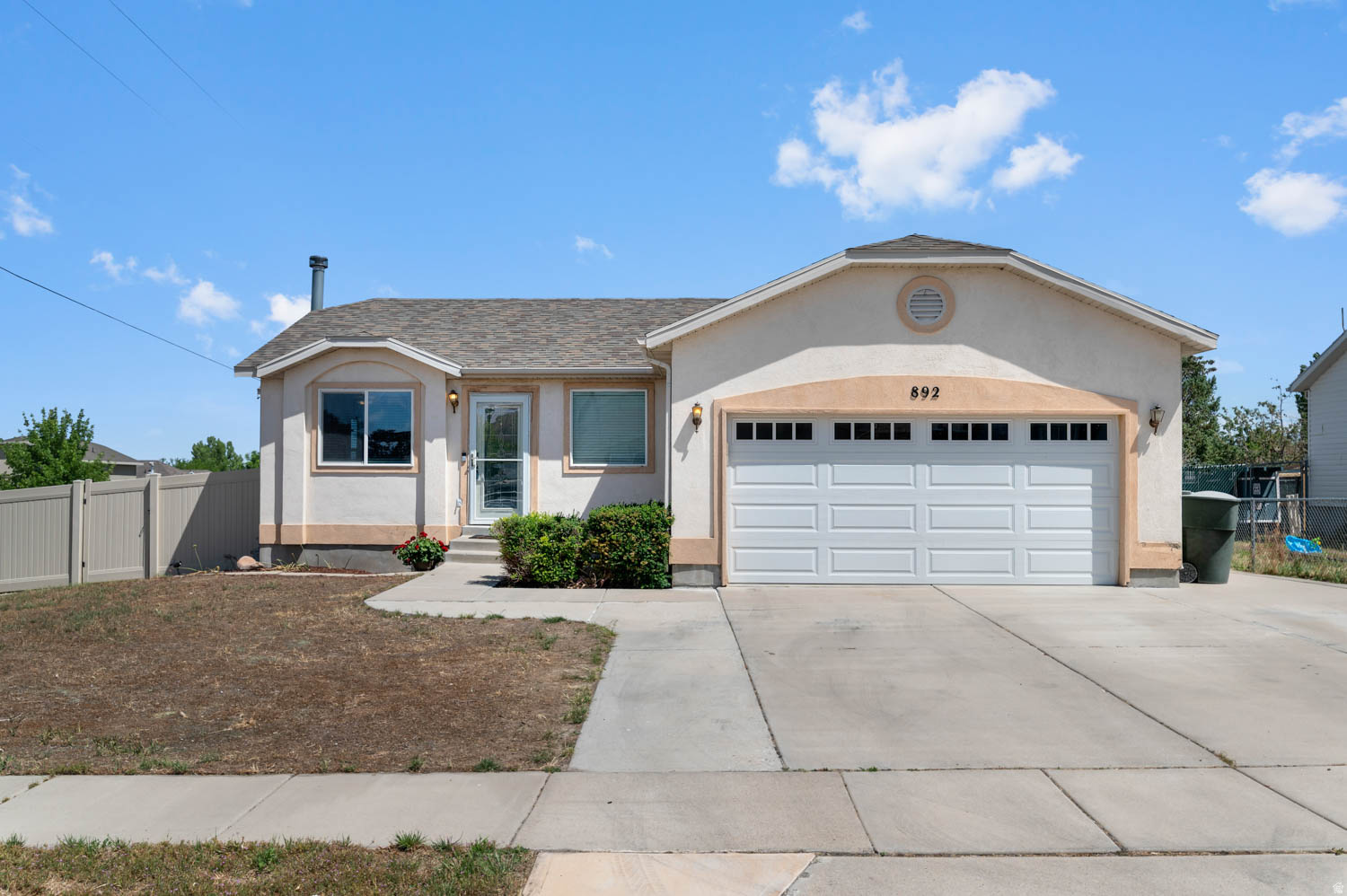 Fantastic well cared for home in a quiet neighborhood in Tooele. The best combination of features and quality for the price in the area!  Outstanding floor plan with a light and bright feel. 4 Bedrooms, featuring a main floor primary bedroom with en-suite bathroom.  The basement has a man cave area with wet bar and wood stove for entertaining, gaming, cards, or movie nights! A spacious 2 car garage will fit some of your toys and the extra parking in the driveway can fit the rest. Loads of updates including:  New Deck for BBQing (2025), New Fencing (2025), New Roof (2023), Updated appliances, New Water Heater (2025), Updated electrical panel (2025).  Schedule your private showing today! Check out the 3d Tour at: https://my.matterport.com/show/?m=eLzGHcG42fA