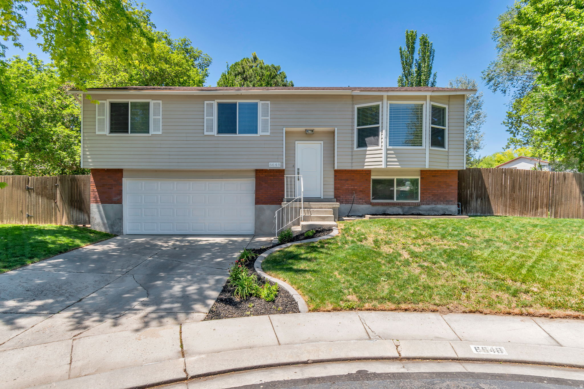 This beautifully refreshed home is truly movein ready and sits on a spacious, private yard filled with mature trees, lush landscaping, and room to relax or play. Tucked away in a peaceful culdesac, it offers the perfect blend of comfort, style, and serenity. Step inside to discover fresh paint, new tile flooring, updated bathrooms, and a fully remodeled kitchen featuring modern cabinets and clean, timeless finishes. Every space has been thoughtfully upgraded to give the home a bright, welcoming feel.
