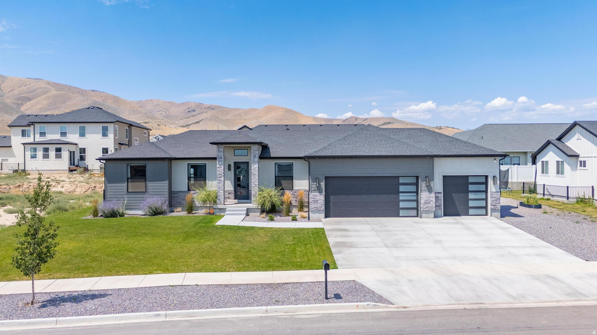 Someone built a $1,000,000 home and then priced it $100K under comps. Custom-built rambler in one of the most sought-after pockets of Saratoga Springs. Nearly 4,000 square feet. Not "4,000 ish sqft  if you count the unfinished basement and the emotional space." Actual finished square feet. The kitchen is fully custom, which means someone with taste made decisions instead of a builder picking whatever was on the truck that week. The great room has 11-foot ceilings - tall enough that your Christmas tree finally stops looking apologetic. Main-level primary suite. Because stairs are a young person's game and you've made your peace with that. Walk-in pantry big enough to justify your Costco habit. Oversized 3-car garage - as in, all three cars actually fit, plus the stuff you swore you'd sell on Marketplace in 2019. The basement has a full ADU. Rent it out and cover $2,000 of your mortgage. Or don't. Use it like a normal basement until your kids hit 24, look at the housing market, and quietly move back in with a duffel bag and a lot of feelings. At least now they'll have their own door. Landscaping is in. Fully. You will not spend a single Saturday of your life dragging sod across a dirt lot while your spouse "supervises." Turnkey. Priced well below comps. Try to build this today and you're north of a million before you've picked a doorknob. OPEN HOUSE SATURDAY, July 18th, 11AM3PM. Come see it before someone with less hesitation than you does.