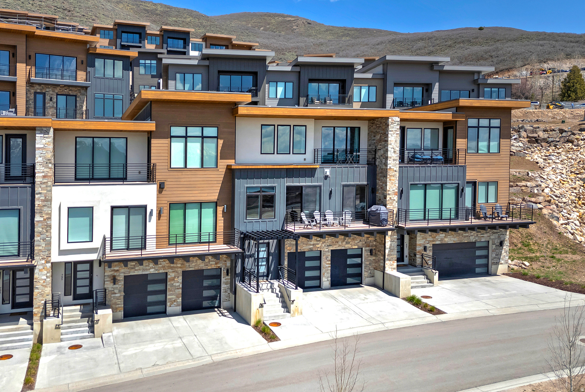 A rare 4-bedroom floor plan and one of just a handful of condos in the complex offering UNOBSTRUCTED views of Deer Valley and the Jordanelle Reservoir from the decks, kitchen, and bedrooms. Two bedrooms feature sliding doors opening to an over-sized deck-larger than most in the community-perfect for morning coffee or sunset gatherings against the mountain backdrop. Inside, you'll find high-end appliances and designer finishes throughout, with the added convenience of the mailbox tower and guest parking just steps from your front door. Whether you're looking for a full-time residence, a mountain getaway, or an income-producing rental, this turnkey property delivers-all furnishings are included in the sale, making it ready for nightly or long-term rental from day one. Location is everything here: Jordanelle Beach and the Outlaw Golf Club (a scenic 9-hole public course with lake and mountain views) are both just 3 minutes away, Historic Park City is 10 minutes away, and the Deer Valley Gondola is a quick 13-minute drive. HOA includes water, sewer, garbage, internet and DirectTV.