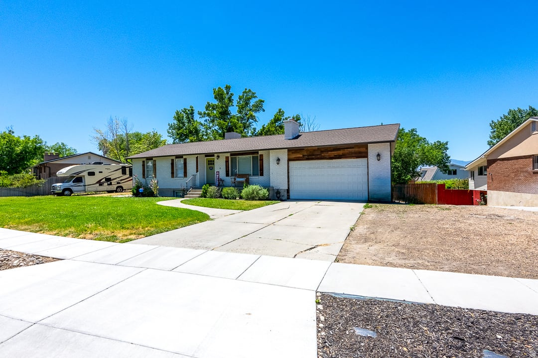 Not only is this home absolutely gorgeous, but it also has an assumable mortgage with the LOW rate of 3.75%.....  Beautifully renovated and thoughtfully redesigned in 2020, this home truly has it all.  The open floor plan is perfect for entertaining, featuring a stunning oversized granite island that serves as the heart of the home and the ultimate gathering spot for family and friends.   You'll love the one of a kind vanities and designer light fixtures that add character and charm throughout.  Downstairs, the private mother-in-law suite offers its own laundry and full kitchen, making it ideal for multi generational living, guests, or as potential income producing rental.   Pet lovers will appreciate the convenient dog bath.  Outdoor enthusiasts will fall in love with the peaceful Zen garden area perfect for entertaining, relaxing, or enjoying your favorite garden projects.   Situated on over a half an acre, this property offers endless possibilities and room to create a lifestyle you've been dreaming of.  This isn't just a house, it's a home filled with opportunity, style, and exceptional value!  Square footage figures are provided as a courtesy estimate only and were obtained from tax records.  Buyer is advised to obtain an independent measurement.