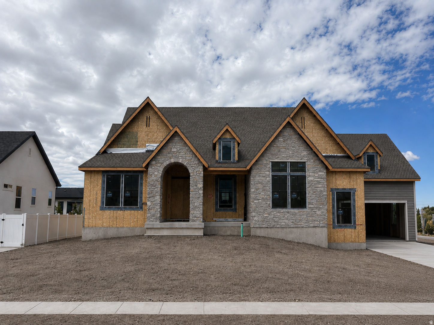 LOT#517. This Treble XL with a European Romantic elevation is one of Symphony Homes best-selling plans. Tons of upgrades throughout! This home is currently under construction and due to be completed in October 2026. Features a true 4-car garage (two 2-car doors) that will be finished to paint. 29x12 covered deck. Enormous Primary Suite has an oversized walk-in shower with built-in bench, freestanding tub, separate vanities, and will have a custom finished wardrobe room with a laundry hookup for convenience. Family room will feature knotty alder wood beam 11' ceiling and a custom fireplace. Kitchen will be equipped with upgraded appliances, including 48" dual fuel gas range, built-in side by side fridge & freezer, and an oversized walk-in butler's pantry with countertops and outlets. Huge dining nook. Finished basement will have 3 bedrooms, 2 full bathrooms, a laundry room and more for entertaining...You'll love the open theater with bar seating, beautiful wet bar, and true walkout basement to backyard patio. Lots of storage space throughout. Quality LVP flooring, extra high ceilings. Large covered patio. Amazing craftsmanship and interior design throughout. List price includes 90k in full yard landscaping.
