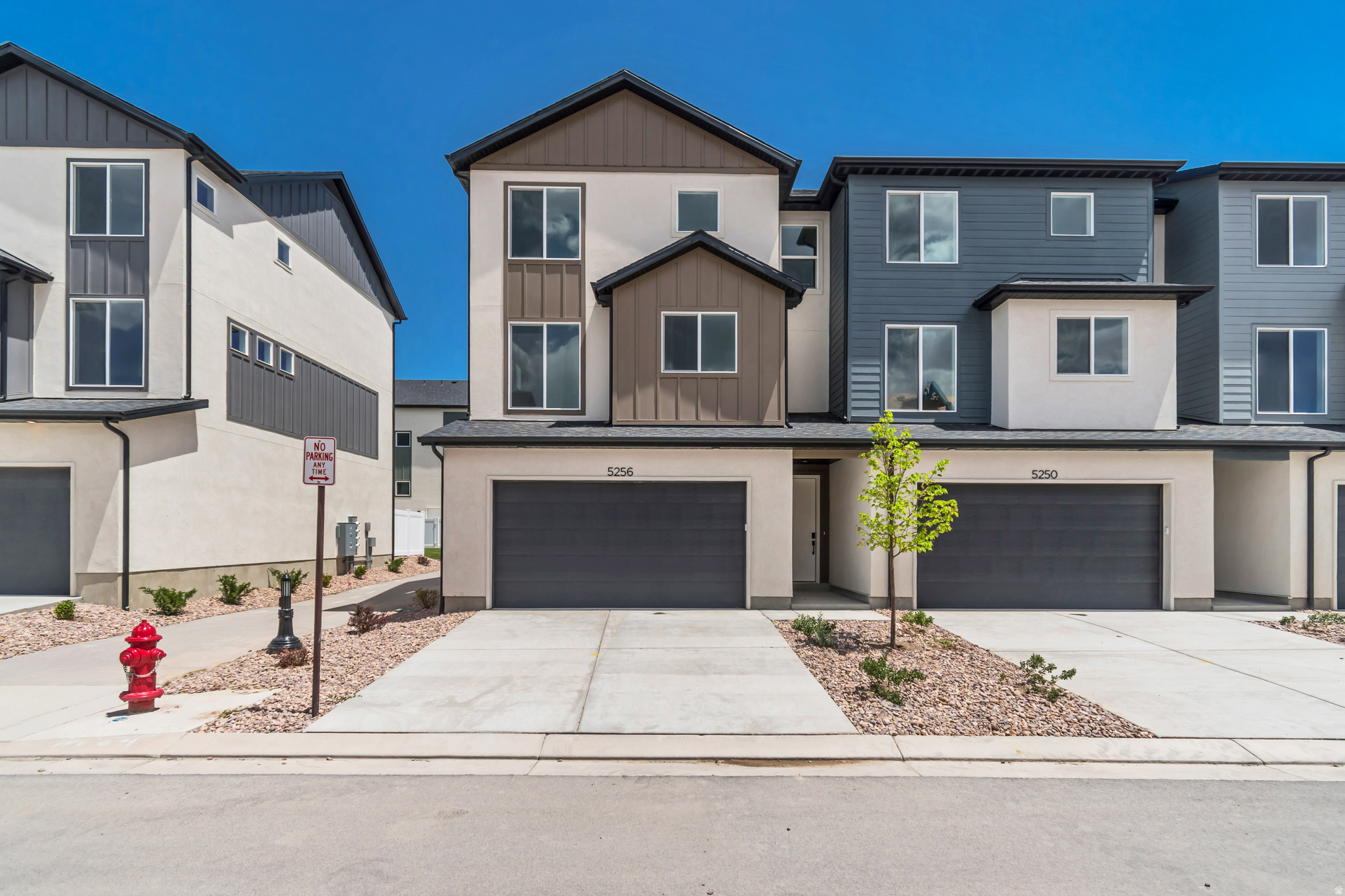 Striking design and exceptional livability, this end-unit townhome offers the perfect blend of style, space, and function. The 3-story layout features 3 bedrooms, 2.5 bathrooms, and a deep 3-car garage with extended storage for vehicles and outdoor gear. Additional windows in both the dining room and primary bedroom, bringing in natural light while showcasing the home's unique setting and views. The main living level feels open and inviting with 9' ceilings, 8' doors, oversized windows, waterproof LVP flooring, matte black hardware, and clean contemporary finishes throughout. The kitchen features quartz countertops, 42" custom cabinetry, soft-close dovetail drawers, pull-out shelving, dedicated storage, a 16-gauge single-bowl stainless sink, premium Moen fixtures, GX Pro disposal with air switch, and LG microwave & range. Upstairs, the spacious primary suite offers dual closets, abundant natural light, and a beautifully finished ensuite with quartz countertops, double vanity, semi-Euro glass shower, and premium Moen fixtures. Above-Standard Features come included - not upgraded - including a 95% Lennox furnace, 14-SEER A/C, Wi-Fi thermostat, Kwikset smart lock, LiftMaster MyQ garage system, Cat-6 wiring, and additional electrical upgrades. Finished with Amsco windows, durable stucco, and James Hardie accents, this home delivers exceptional design, lasting quality, and a homesite that's every bit as impressive as the home itself.   Square footage figures are provided as a courtesy estimate only and were obtained from builder's plans.  Buyer is advised to obtain an independent measurement.