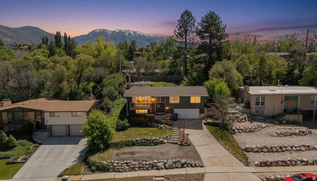 Best views in the neighborhood! This beautifully landscaped home features an open-concept floor plan with expansive windows & a spacious deck showcasing breathtaking views. The main floor offers 3 bedrooms, including a primary en-suite. step into the basement that leads to an oversized garage with a workshop area. Enjoy your own backyard oasis with a private deck, garden boxes, & lush landscaping. All conveniently located near schools, parks, & a fishing pond.