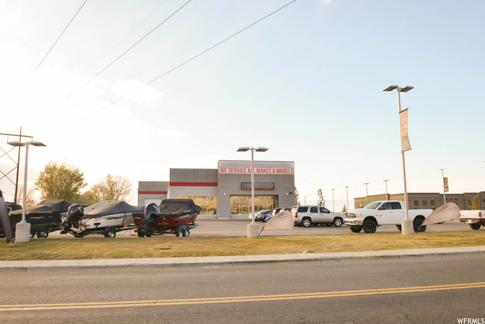 AMAZING LOCATION. Faces I-i5. Springville Frontage Rd. Beautiful building for auto/marine/heavy equip/vehicle dealership or retail sales company. Well lit, all glass showroom facing the freeway, 250 display/service stalls. 5 Offices, break room and conference room upstairs with beautiful views. Bathrooms up and down. Parts room, Service bay, 4 offices on main. 8 garage doors, 9 bays, 4--12' doors, 4--14' doors. permanent fixture signage visible from I-15. Billboard negotiable directly above. Fenced in/secure storage. full landscape. If you want I-15 exposure, this is it. nothing else avail in this area. When new off-ramp goes in south Springville, you'll be glad you bought when you did! over 500K cars a day pass by...15M/mo...186M/yr...tons of exposure! Business is negotiable. Business is NOT included in this price.  please call for details.