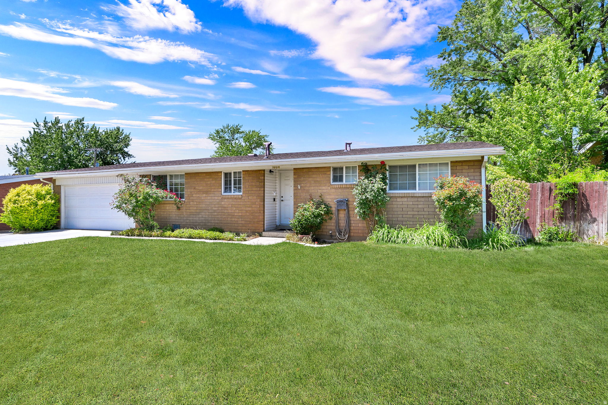 Solid, clean, and full of potential! This classic brick rambler in Lindsay Park offers easy one-level living with updated flooring, newer insulated front door, covered back patio, and all appliances included: dishwasher and fridge less than a year old. Great location and a great fit for first-time buyers or those looking to simplify life a bit.