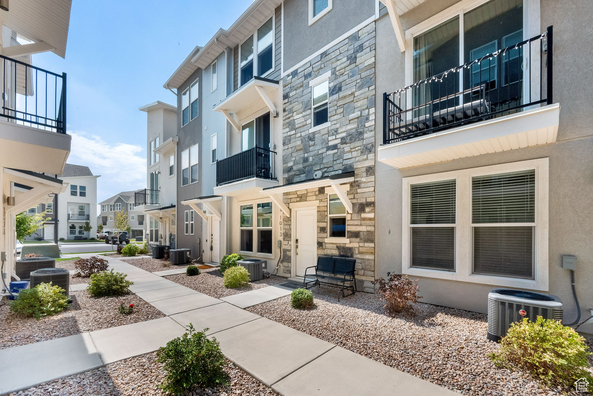 MOVE IN READY! Welcome to The Soho model in The Ridge at Spanish Fork. This spacious townhome offers 3 bedrooms, including the largest primary suite in the development, along with 2.5 bathrooms and a flexible layout ideal for modern living. The lower level features a cozy family room and an extra-deep two-car garage with a LiftMaster HD WiFi-enabled opener and a 240V Level 2 EV charger-perfect for today's connected lifestyle. Upstairs, the open-concept main floor includes a bright kitchen, dining area, family room, generous laundry space, and a half bath. A versatile bedroom on this level doubles as a perfect home office or guest suite. The top floor is home to two more bedrooms-each with its own en-suite bathroom-providing excellent privacy and comfort. Thoughtful upgrades throughout include: Custom Graber pull-down and pleated window/door shades, Remote-controlled ceiling fans, Premium upgraded fixtures in the kitchen and baths & Daytime privacy window film. This home combines style, function, and efficiency in a prime location near all that Spanish Fork has to offer. A must-see for buyers seeking space, comfort, and convenience! Square footage figures are provided as a courtesy estimate only and were obtained from floorplan.  Buyer is advised to obtain an independent measurement.