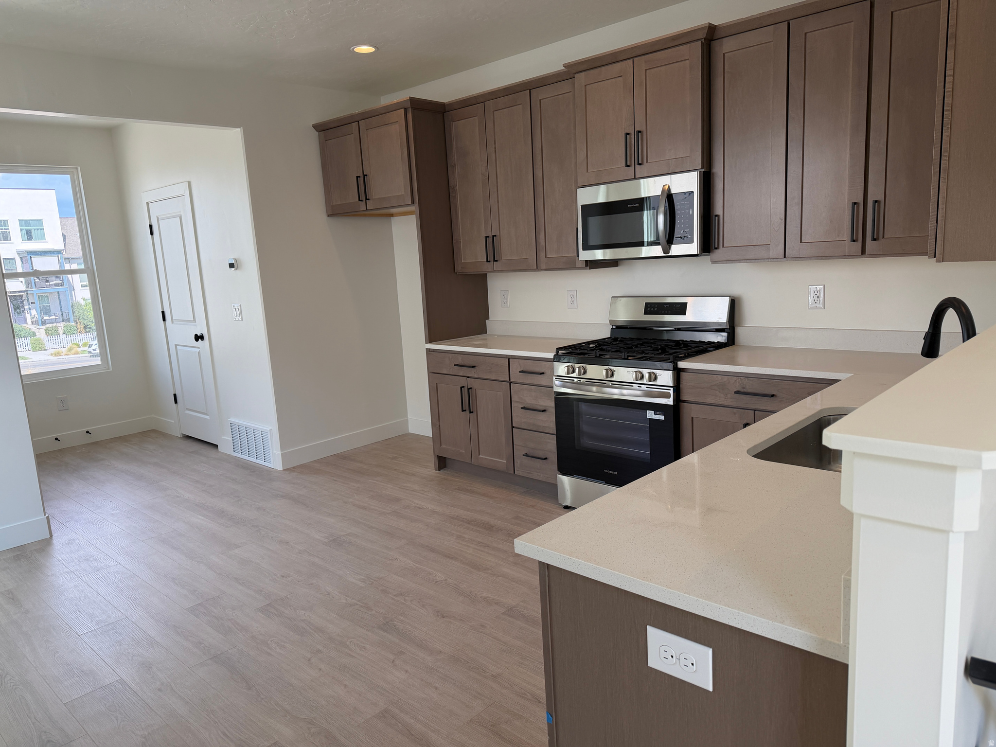 Urban Living in the Heart of Downtown Daybreak! Just a Short Walk to the Bee's Ballpark, this Manhattan Townhome Offers 2 Bed, 1.5 Baths, and a Flex Room that's Perfect for a Home Office, Workout Space, or Whatever Fits your Lifestyle. You'll Love the 9-Foot Ceilings on Every Floor and Open Railings Throughout that Give the Home a Bright, Open Feel. Ready for Quick Move-In Now! Photos are of the Actual Home. Preferred Lender Incentive Available-Ask Listing Agent for Details!