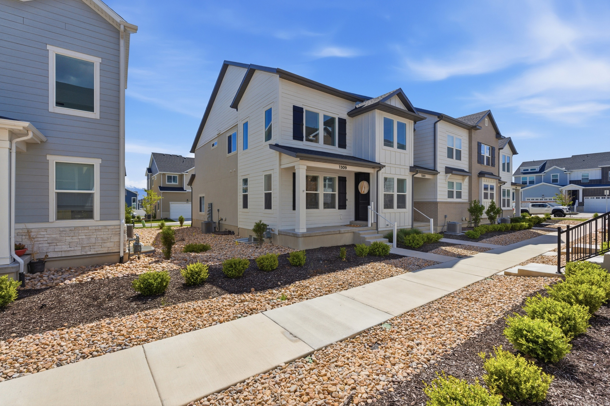 Beautifully designed end-unit townhome offering the ideal balance of low-maintenance living and the space and functionality you love in a single-family home. With generous living areas, and a spacious two-car garage, this home delivers both comfort and convenience. This home has the largest front patio layout in the development creating an inviting outdoor living space. Thoughtful interior enhancements such as upgraded Moen faucets, an improved powder room, and a built-in mudroom bench with dividers, add both style and everyday practicality. Residents of Gardner Point enjoy exceptional community amenities including a clubhouse with fitness center, large swimming pool, and pickleball courts. Perfectly positioned in the heart of Lehi, this neighborhood places everyday essentials and favorite destinations within easy reach, including Costco, Outlets at Traverse Mountain, Intermountain Primary Children's Hospital, Thanksgiving Point, Olympic Park, Jordan River Trail, quick freeway access, schools, dining, and recreation.